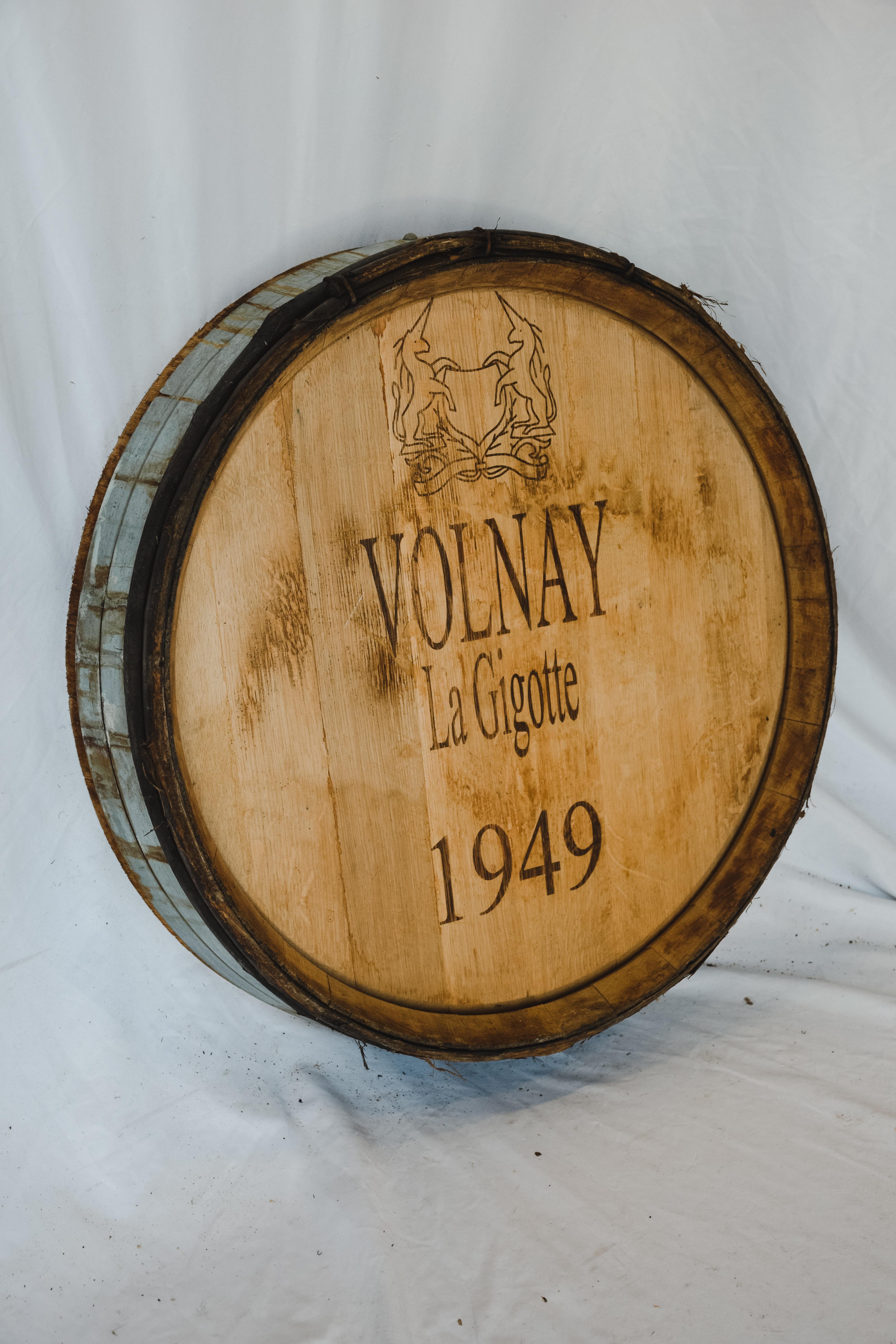 This Antique Wine Barrel Façade comes out of the wine cellars in France. The character and aged wood give it perfect presentation to hang in your wine room or any living space. The Volnay La Gigotte 1949 custom stamp was added at a later date.