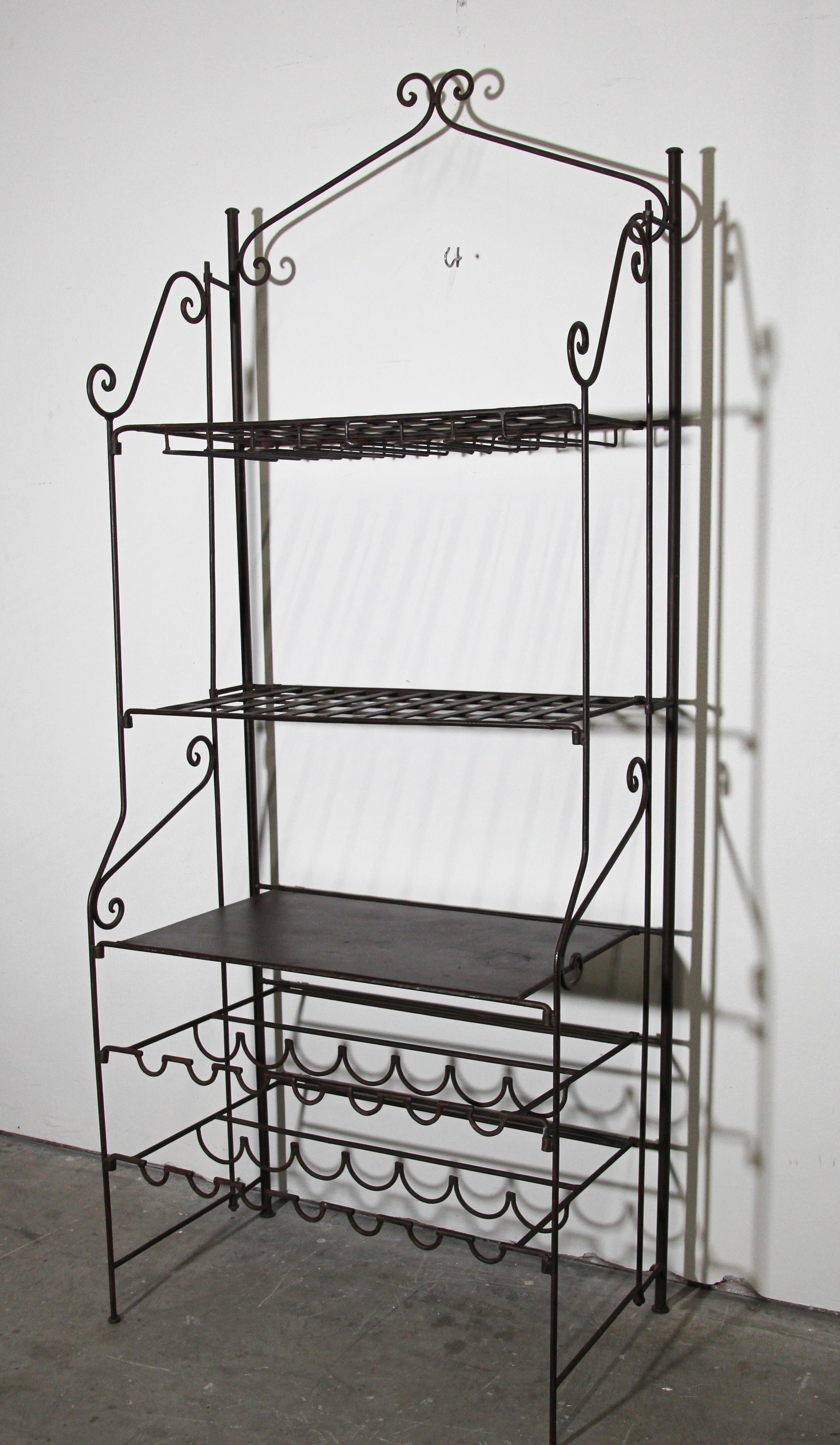 Handcrafted stylish original French wine iron bar rack with scrolled shelf supports details. 
Perfect in the kitchen or any room, indoor or outdoor.
Hand-forged wrought iron wine rack with shelving and glass holder.
Wine baker racks are used