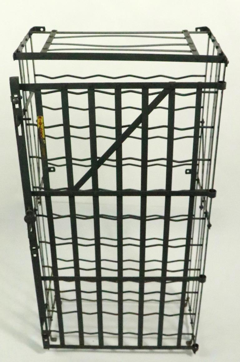 Nice early industrial style wire wine rack, storage locker by Rigidex. Clean, original condition, ready to use condition. The locker can be used freestanding, or can be wall-mounted if you prefer.