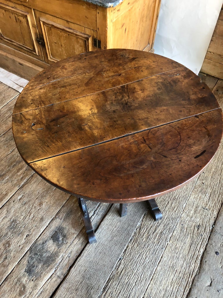 A charming 18th century French tilt-top wine tasting table in walnut, nice small size with original base and great patina.