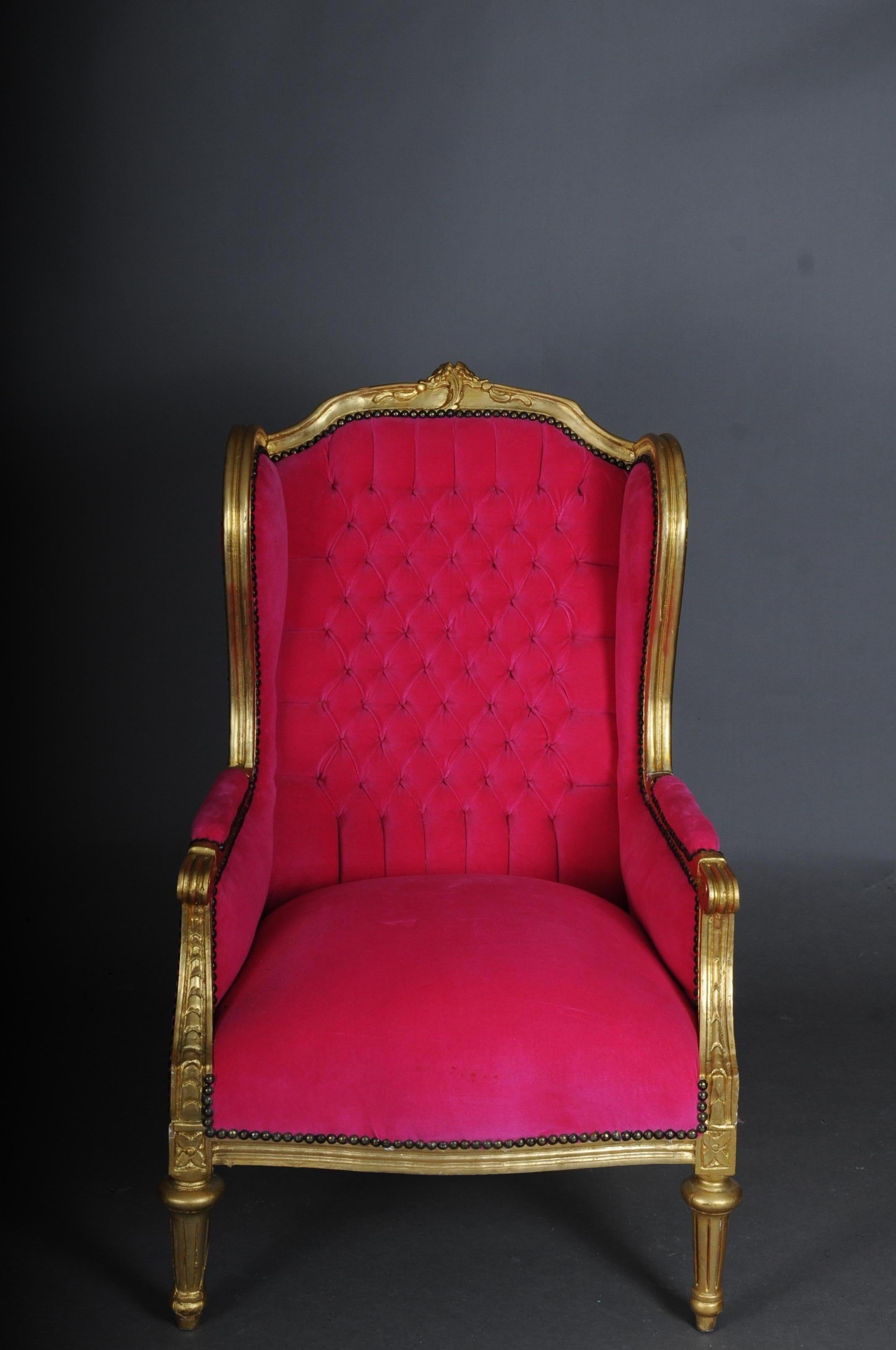 French wing chair Louis XVI, pink velvet fabric

Solid beechwood, carved, gold painted and gilded. Rectangular rising backrests framed with rocaille crowns. Carefully curved, carved frame. Frame on fluted legs. The seat and backrest are processed