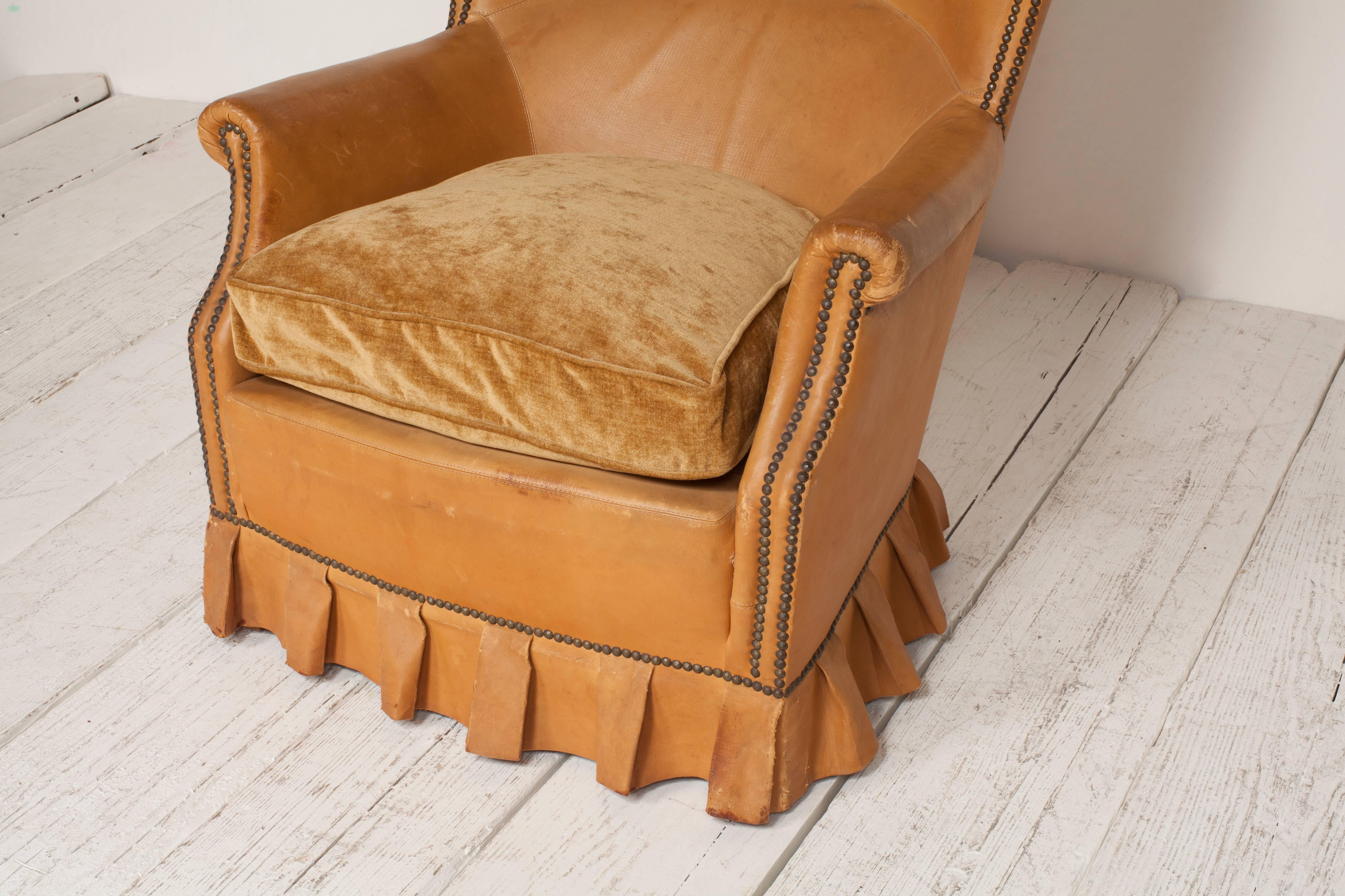 French Winged Leather Club Chair with Boxed Pleated Skirt In Distressed Condition In Los Angeles, CA