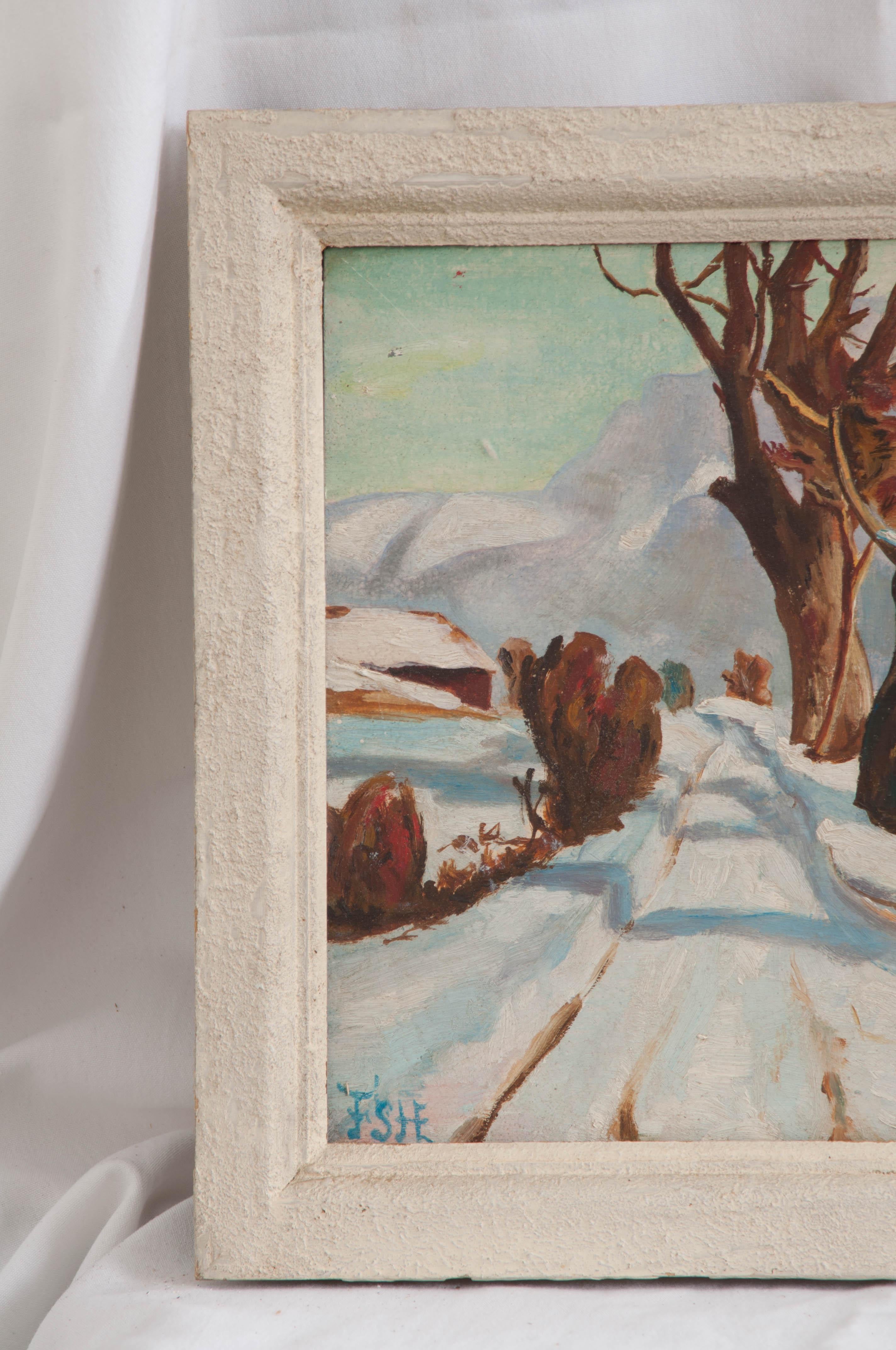 French painting of a French country road covered in snow, framed in a painted wood frame.