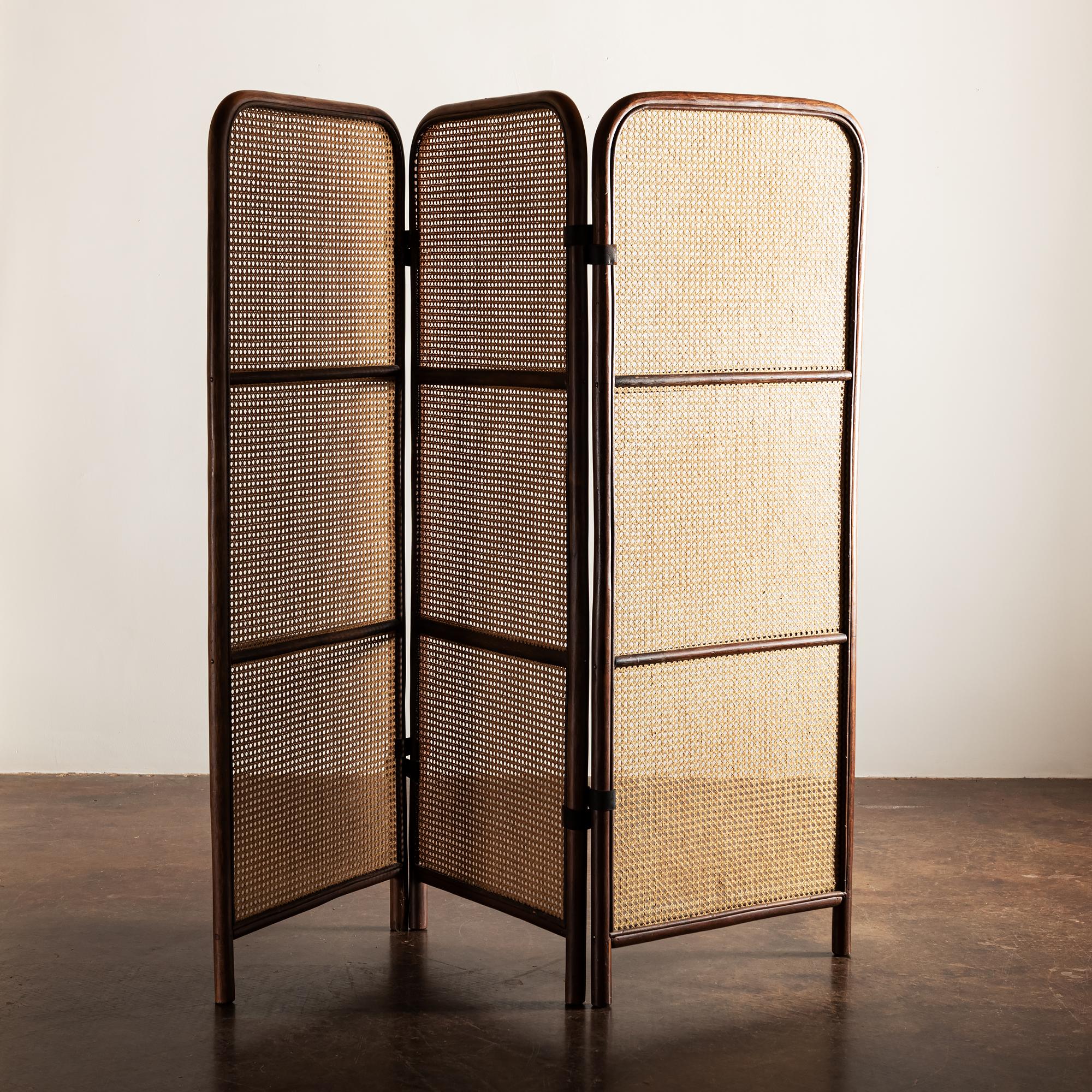 Lovely three-panel room divider in wood and cane with leather hinges, France, 1950s.