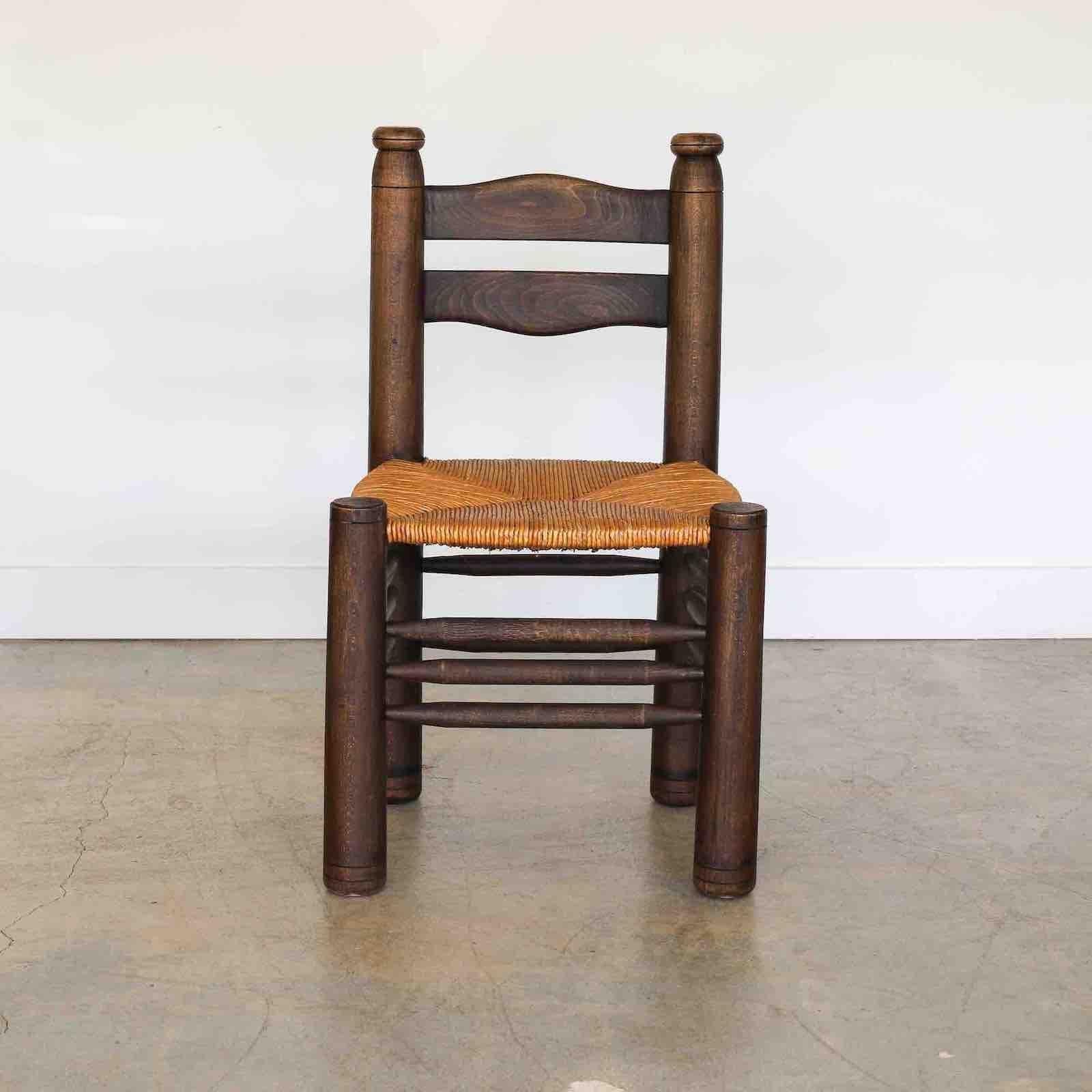 20th Century French Wood and Woven Chair by Charles Dudouyt For Sale