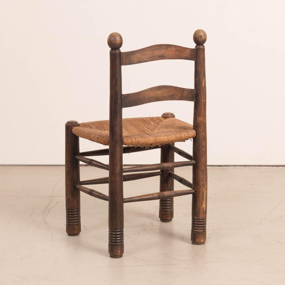 20th Century French Wood and Woven Chair by Charles Dudouyt For Sale