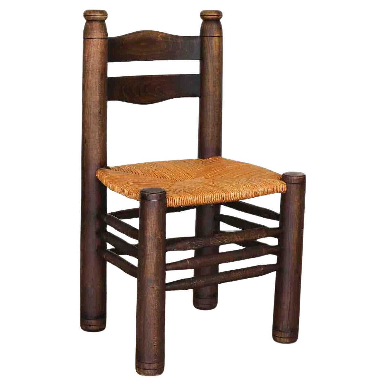 French Wood and Woven Chair by Charles Dudouyt For Sale