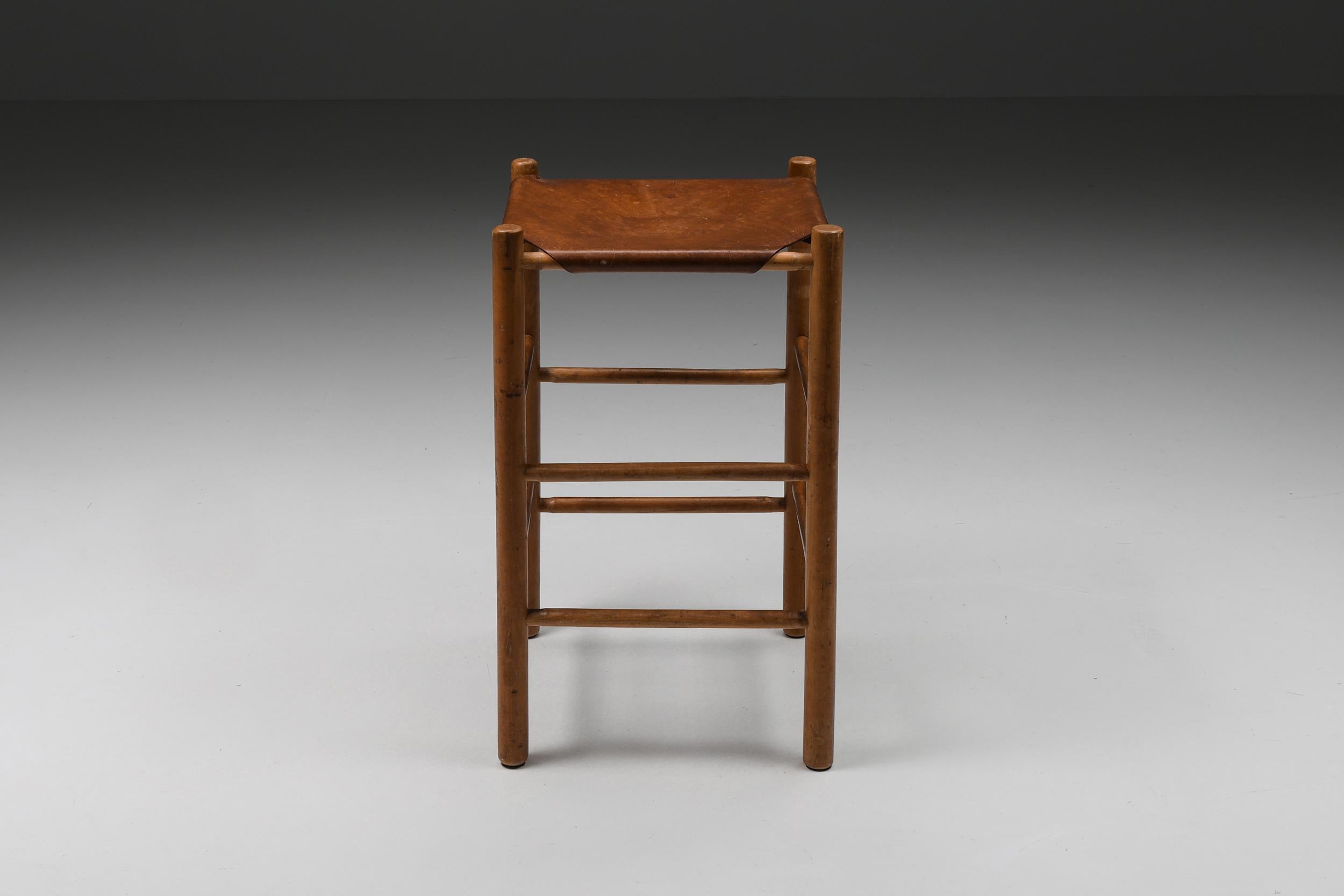 French Wood & Leather high stool, bar stool, Mid-century Modern, Craftsmanship, 1950's

Mid-century modern bar stool. Made in France in the 1950s this chair is an ideal addition to a high desk or kitchen island. The structure is made out of wooden