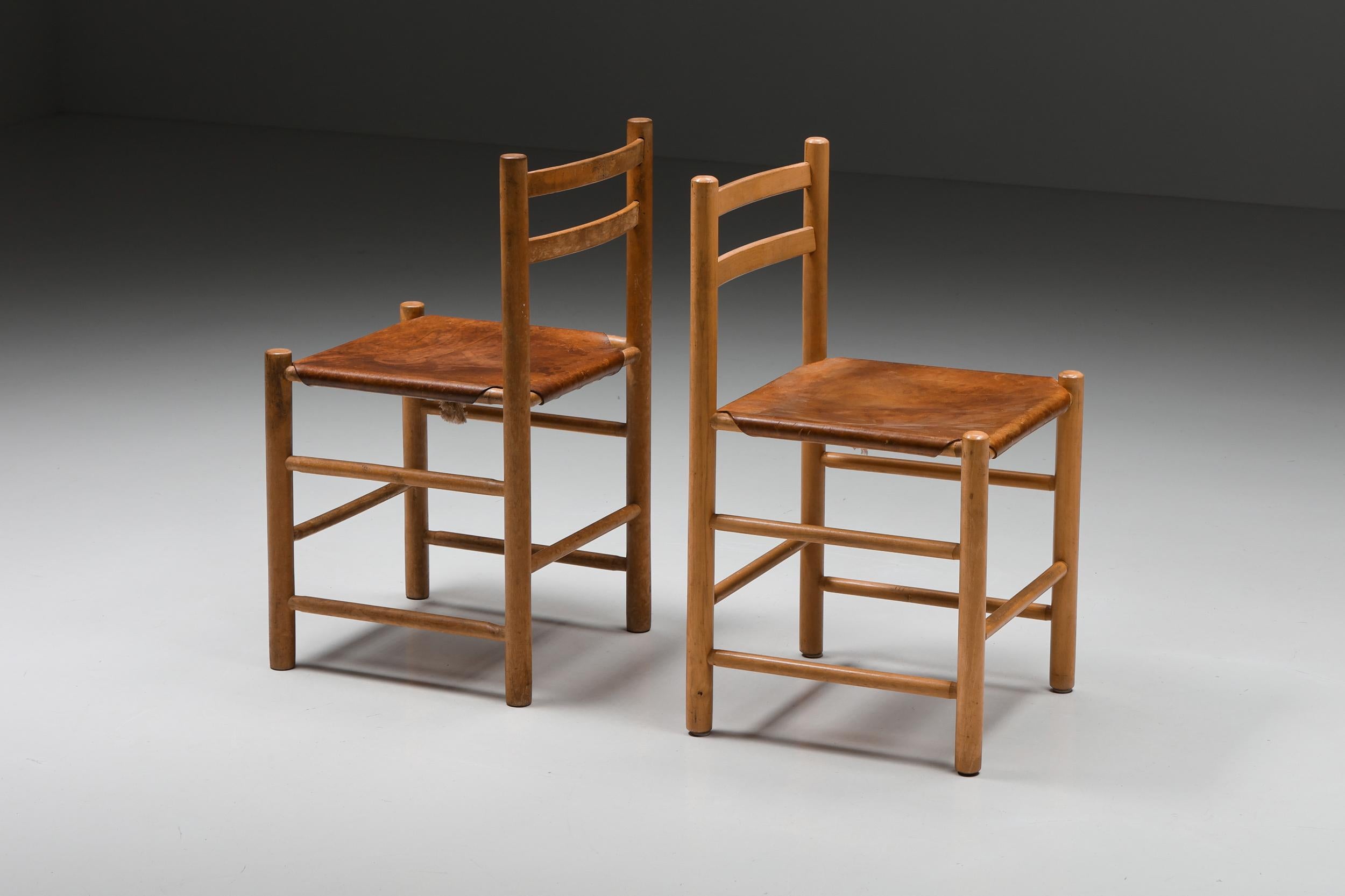 Französische Esszimmerstühle aus Holz und Leder; Mid-Century Modern; Handwerkskunst; 1950er Jahre, Frankreich;

Moderne Esszimmerstühle aus der Mitte des Jahrhunderts, die in den 1950er Jahren in Frankreich hergestellt wurden. Das Design zeichnet