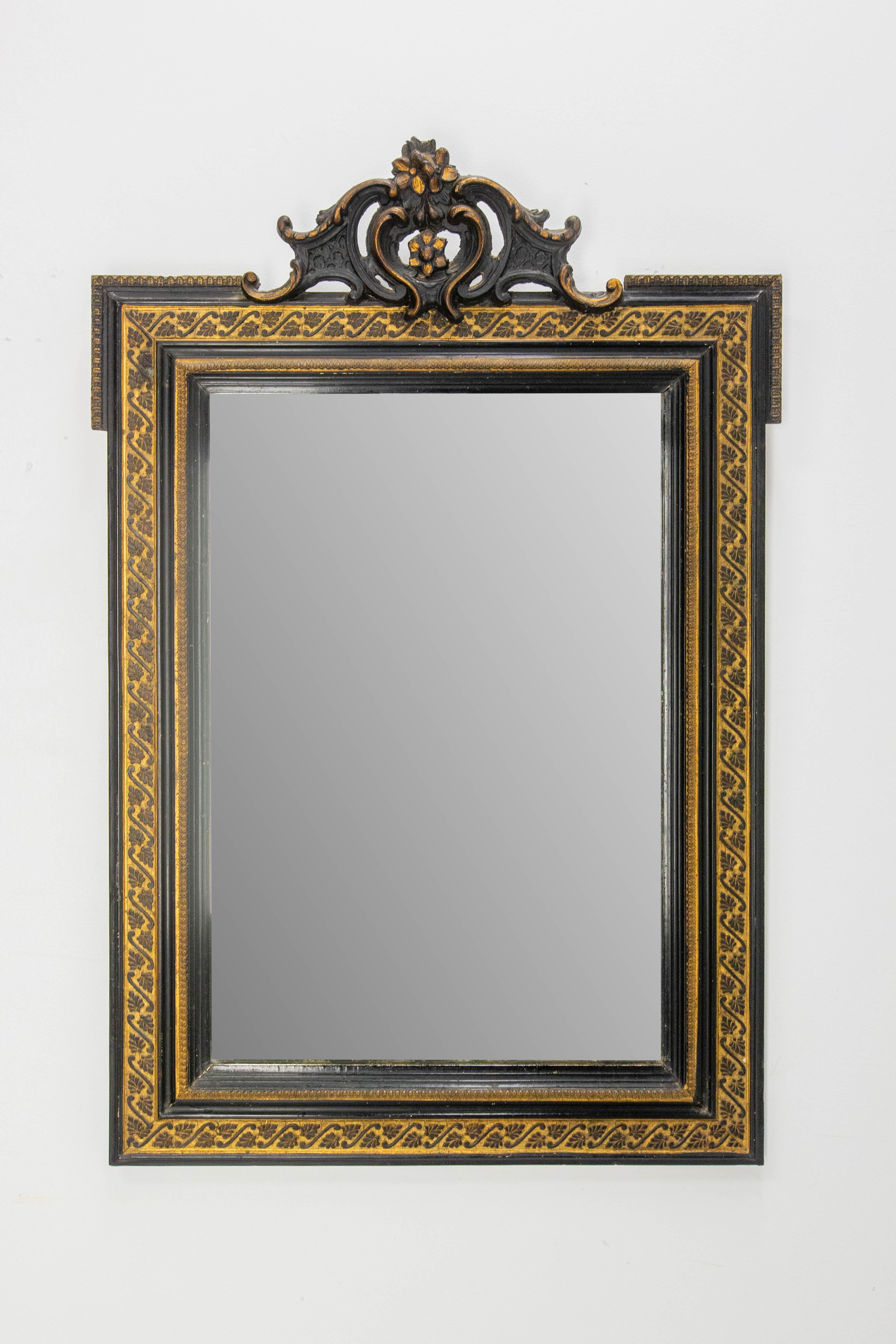 Napoléon III wood and stucco wall mirror painted of black and gold.
The black ans gold furniture are typical of the Napoleon III period.
The mirror is the original, with marks of time whch make a part of the interest of the mirror.
Good antique