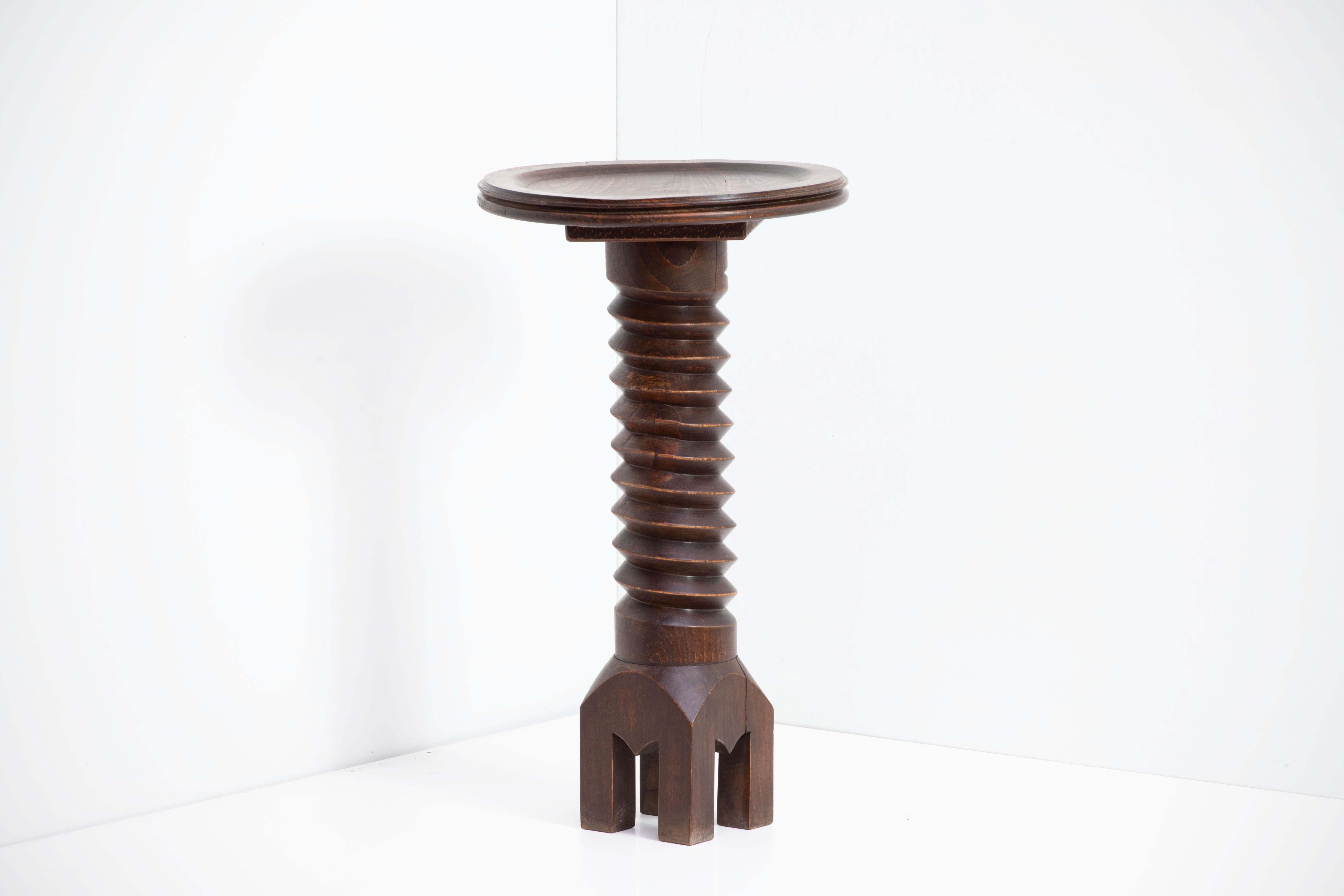 Beautiful carved wood table in the style of Charles Dudouyt, made in France, 1940's. Dark wood finish with circular top and four leg base.
A major figure in early 20th-century French design, Charles Dudouyt moved France’s design aesthetic from an