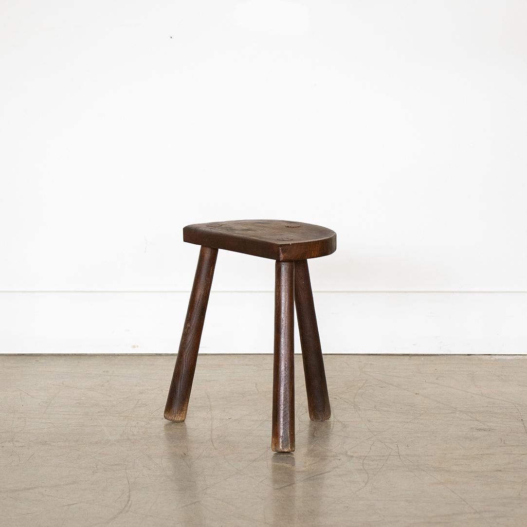 Vintage wood stool with semi-circle seat and beautiful wood tripod legs from France. Original wood finish with great age markings and patina. Can be used as small stool or as side table.
  