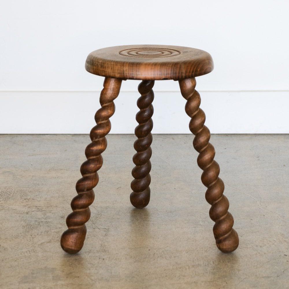 Unique vintage stool with circular seat and thick twisted tripod legs from France. Circular seat has beautiful carved ring detail on top. Original wood finish with great age markings and patina. Can be used as a stool or as side table next to chairs.