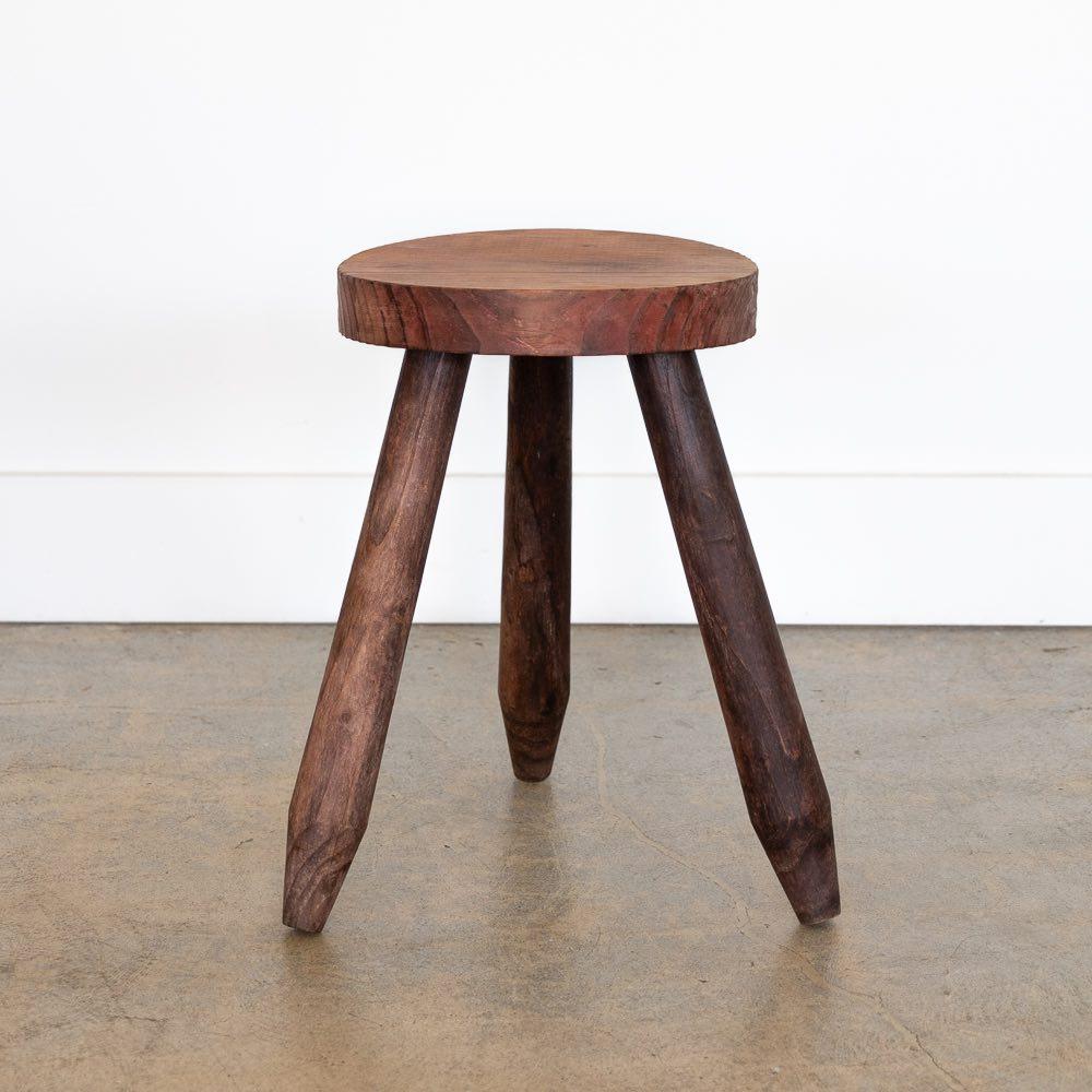 Vintage rustic wood tripod stool with circular top and smooth wood legs from France. Original matte finish shows nice age and patina. Can be used as stool or as side table next to chairs. 

