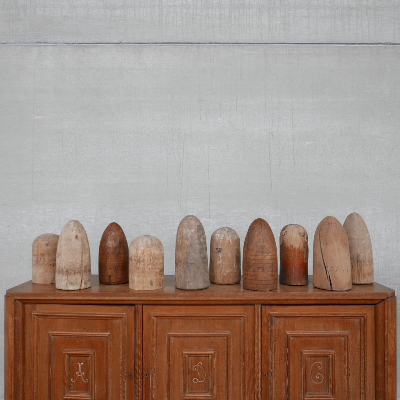 A set of ten decorative wooden molds likely of millinery origin. 

Varying sizes and shapes these look great in volume as decorative tactile curios. 

France, c1920s. 

Price is for the set of 10 but they could be sold in smaller volumes.