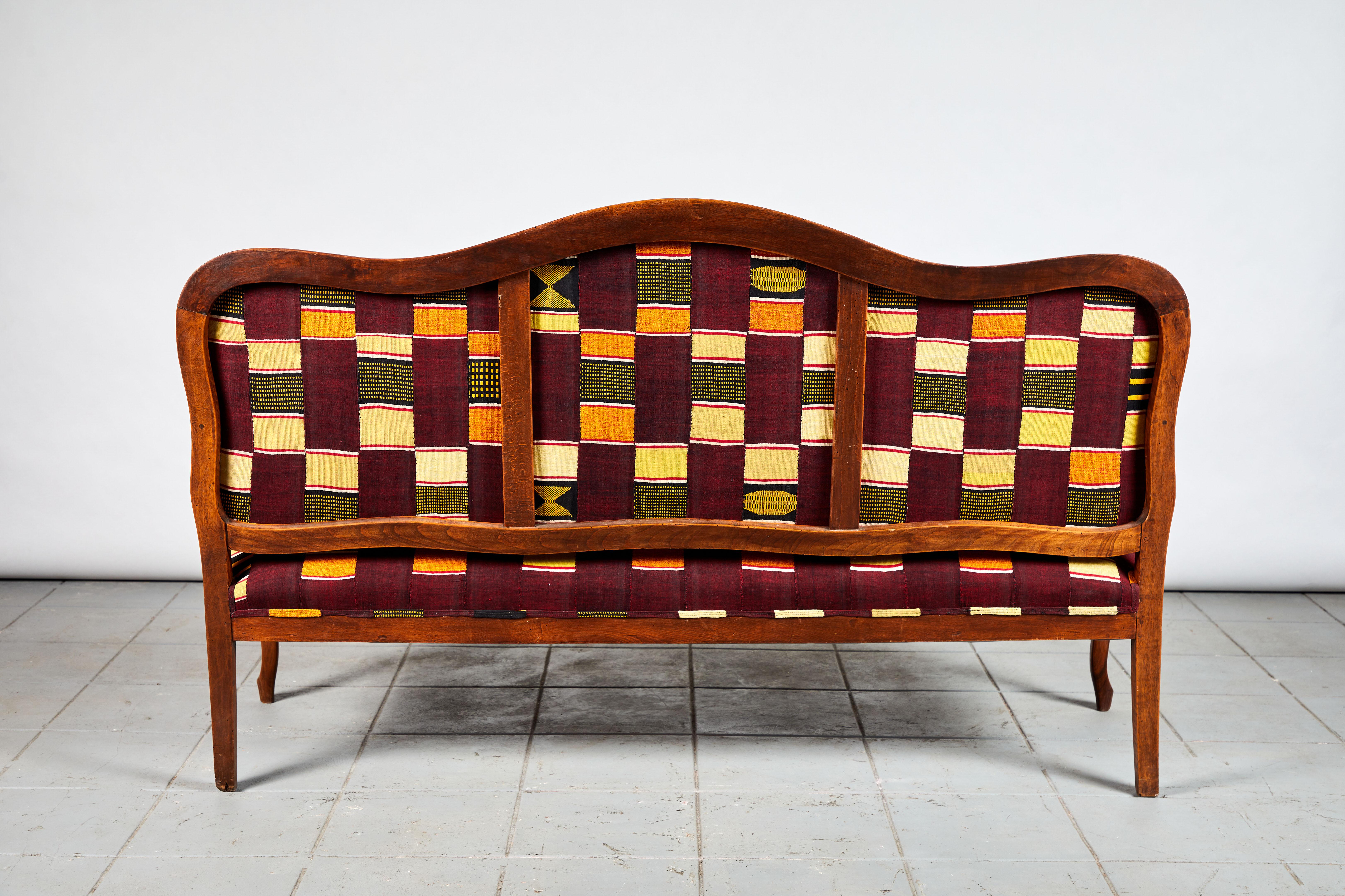 French Wooden Framed Camelback Bench in Ewe Fabric from Ghana 1