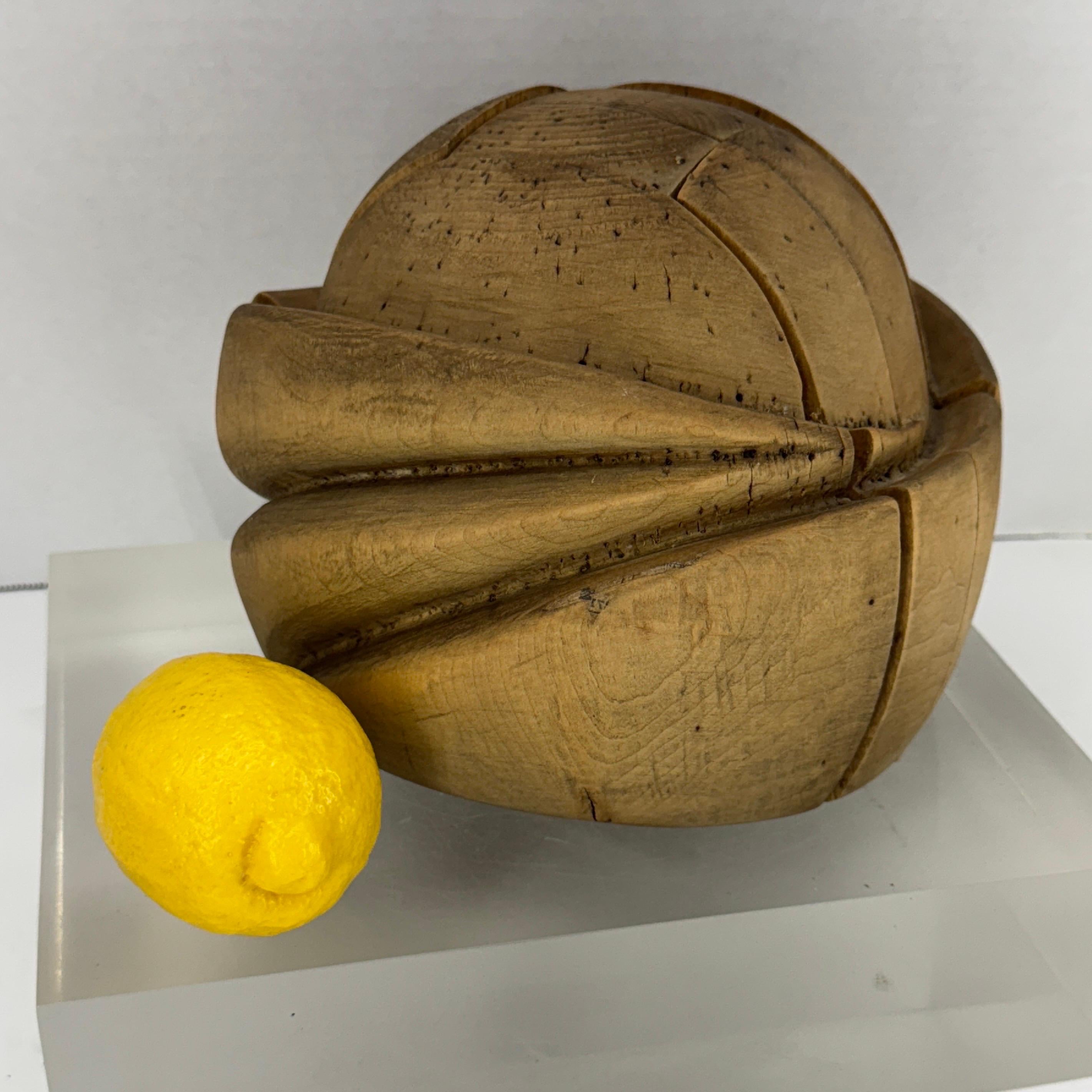 Early 20th Century French wood hat form, turban shape. The French hat form would make a wonderful hat rack, vanity accessory, or sitting high and mighty on a bookshelf. A conversation piece as well as functional consider this hat form for your