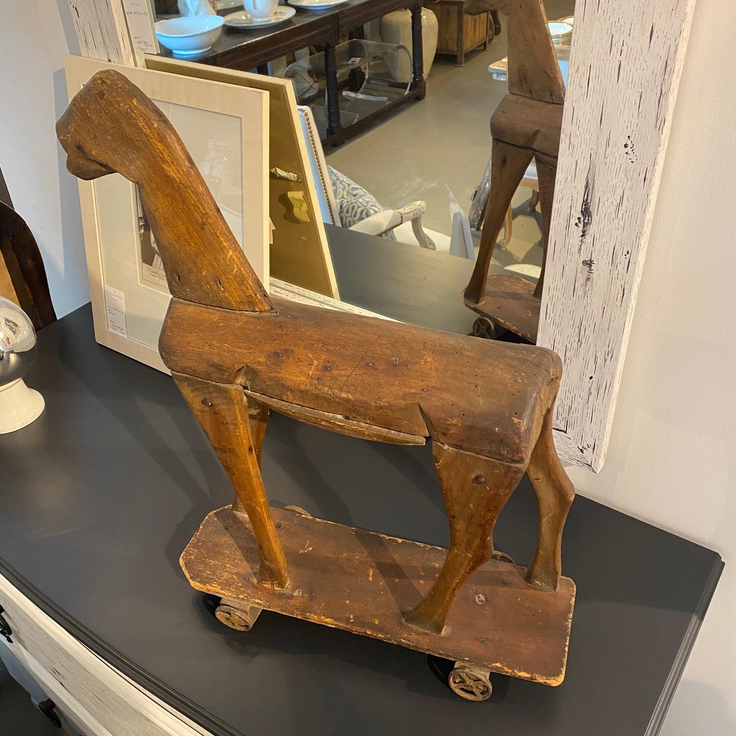 vintage wooden horse on wheels