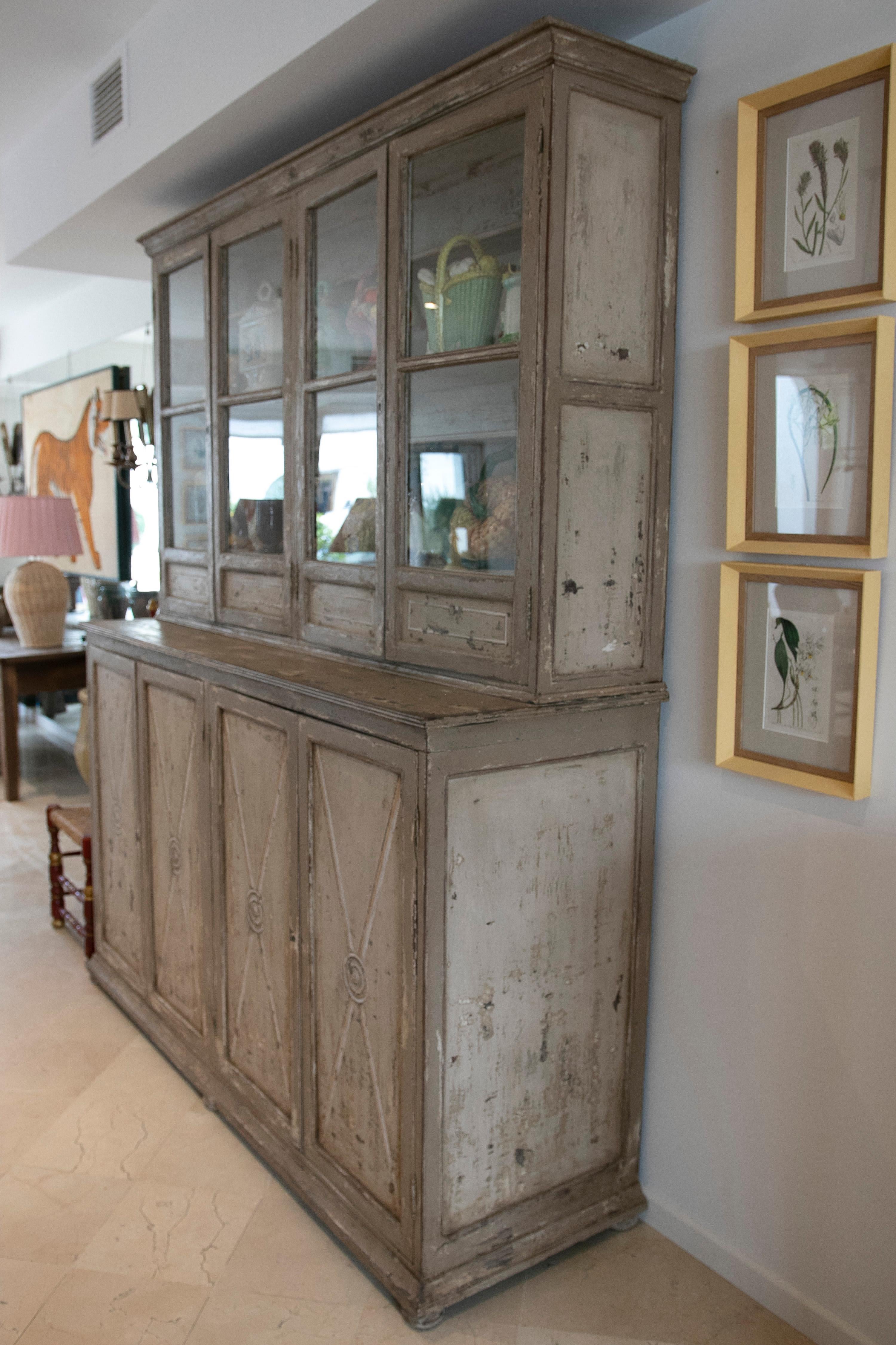 French Wooden two-piece vitrine with glass and hand-painted.