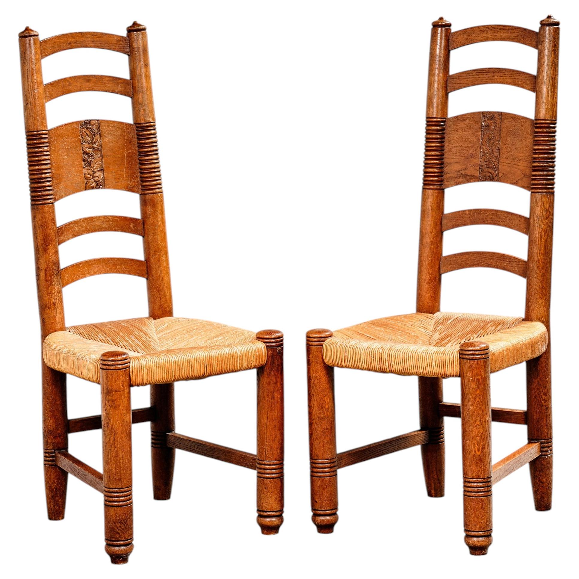 French Work, Pair of High-Back Oak Chairs with Rush Seats, circa 1940–1950 For Sale