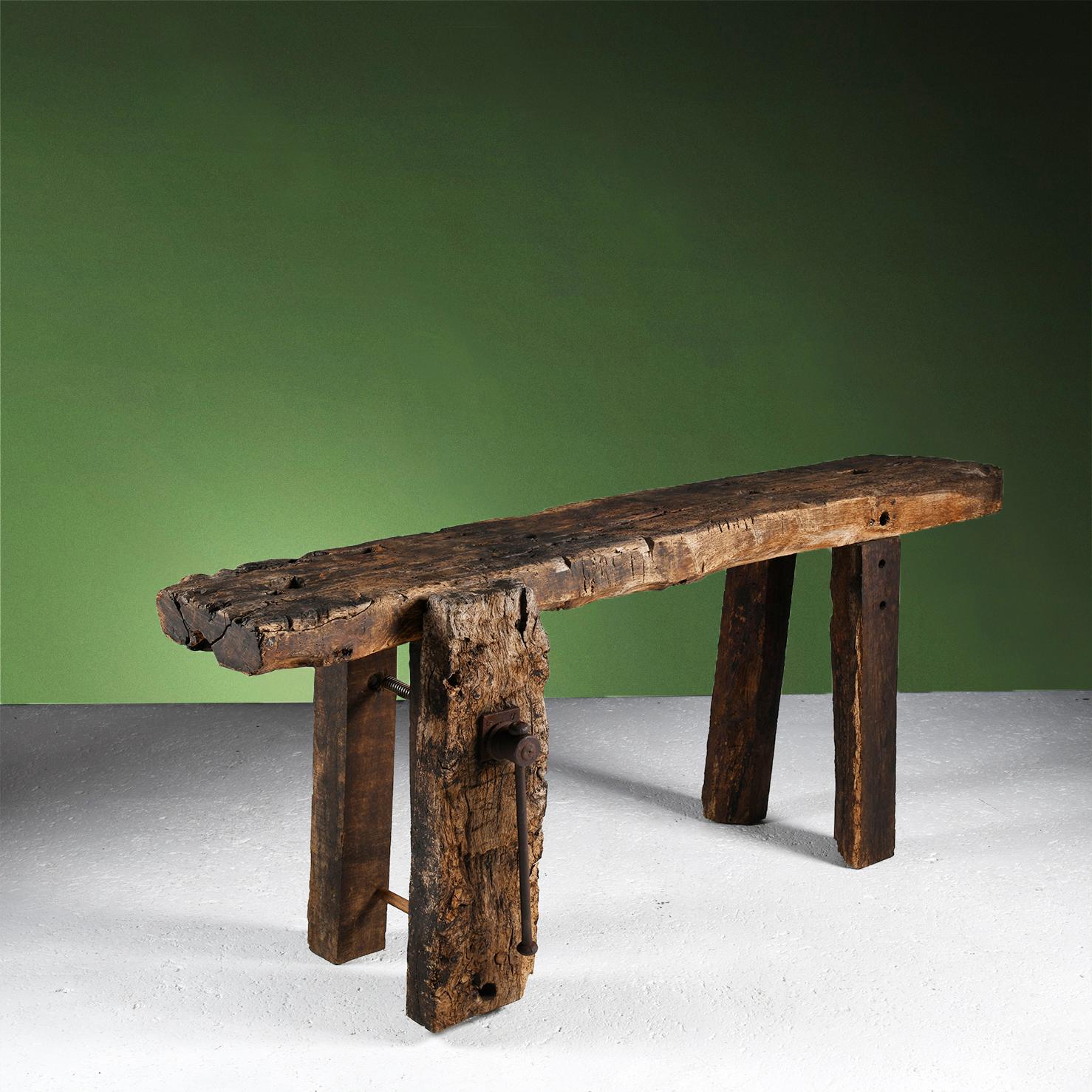 Mid-Century Modern French workbench in worm-eaten oak with a superb patina of age