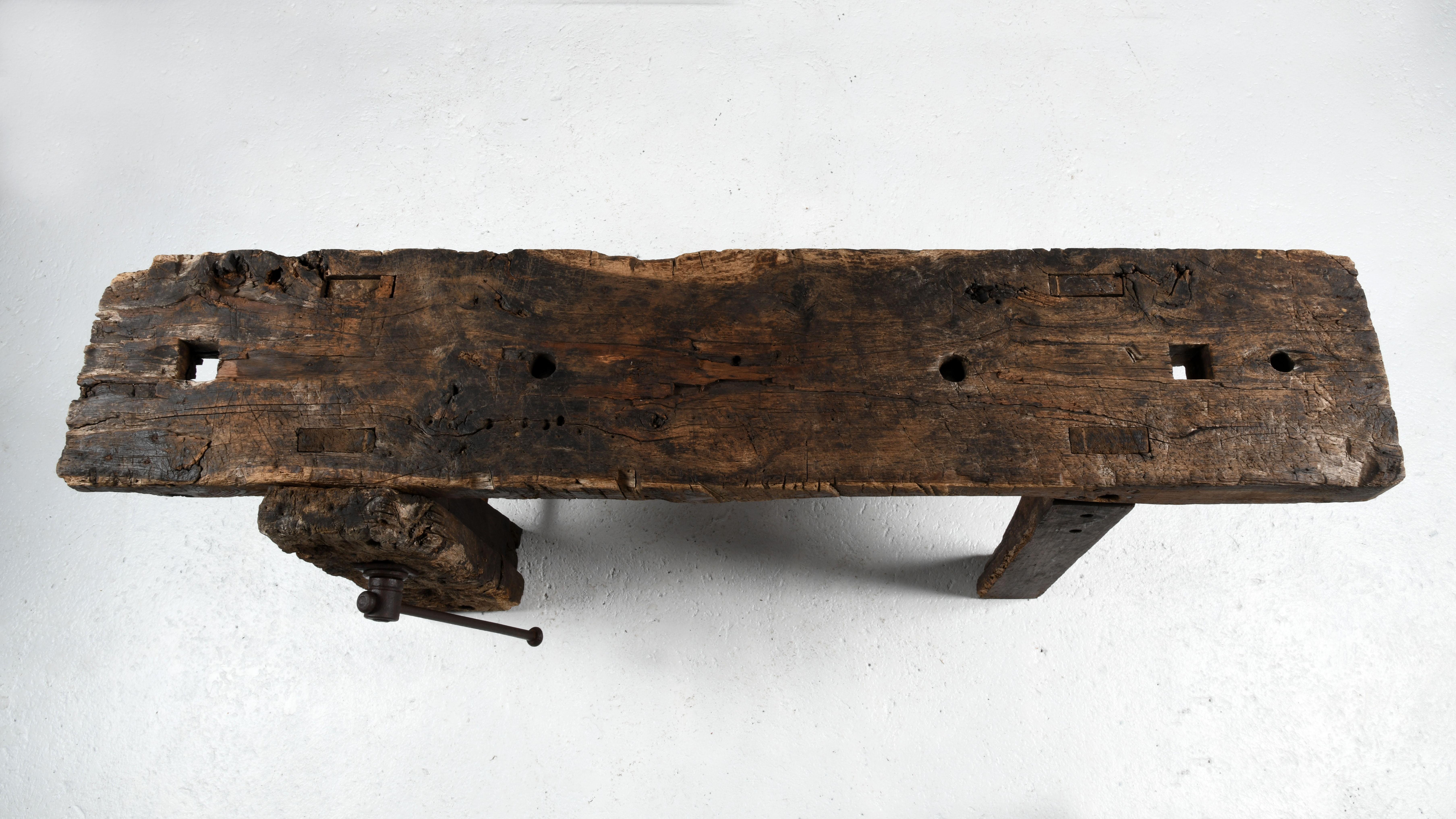 20th Century French workbench in worm-eaten oak with a superb patina of age