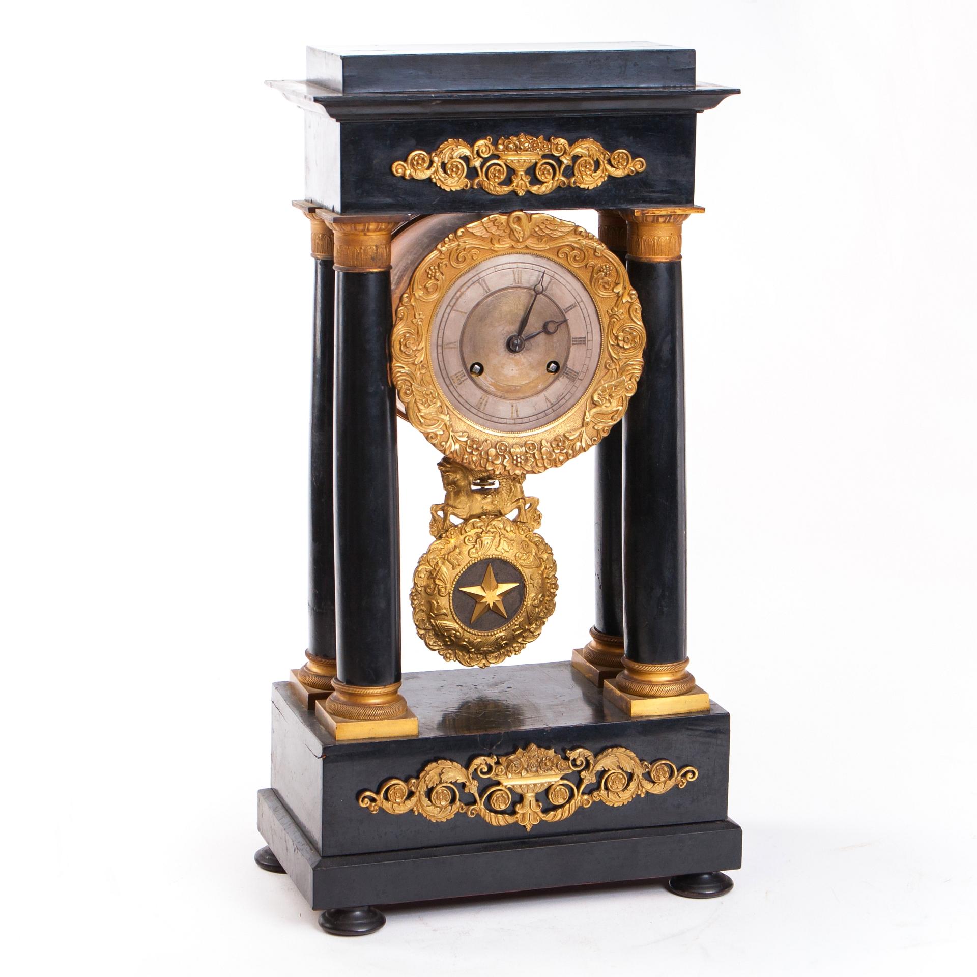 The piece is an exquisite and rarely still working fireplace clock, from mid-19th century France. 

The clock works on a French spring mechanism. The clock comes with the original key used for turning, and when on, its bell strikes every half an