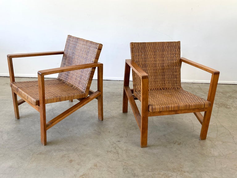 Beautiful woven cane chairs with angular frame - France, circa 1950's 
Great patina to wood and cane.