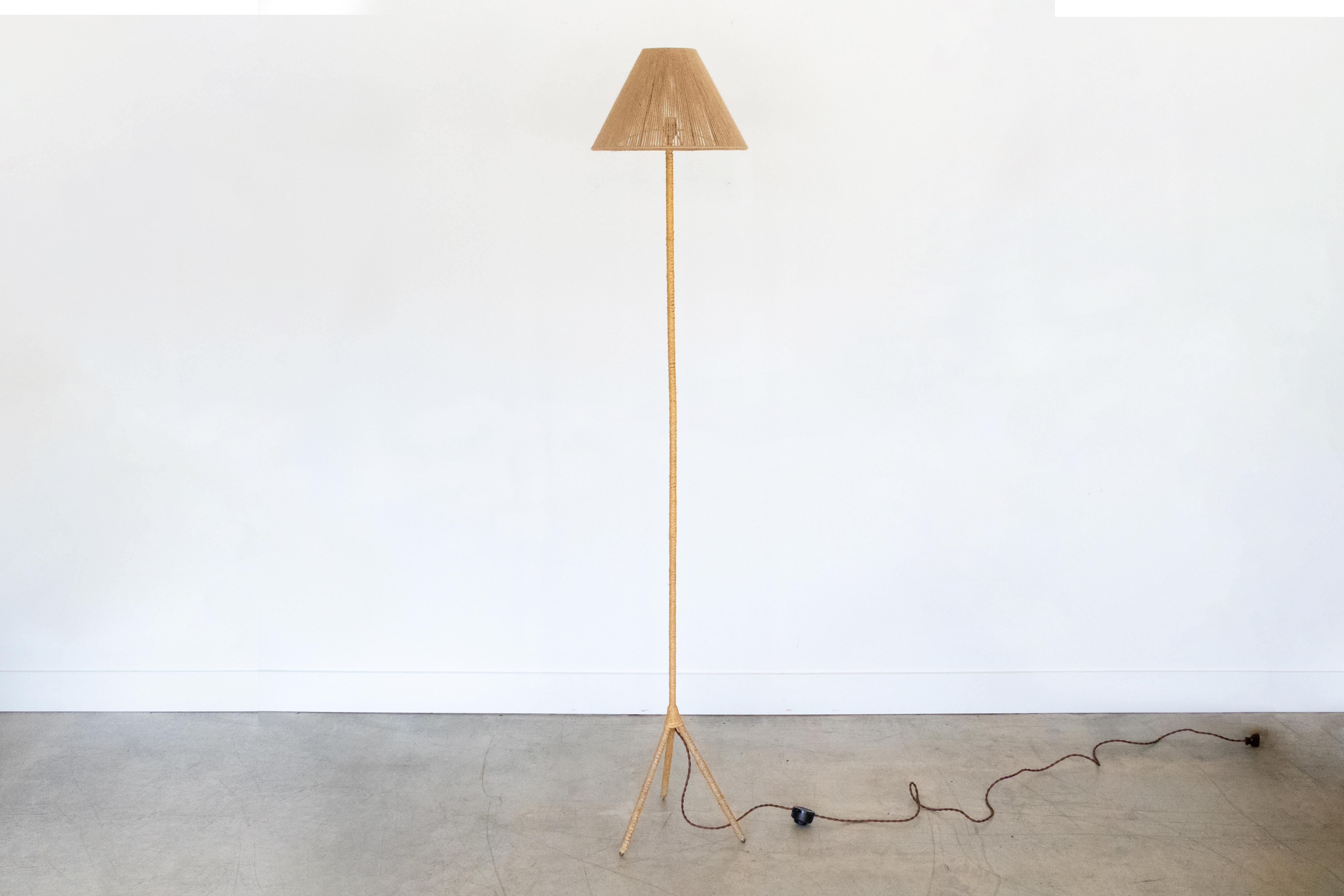 Beautiful woven floor lamp with tripod base and new rope shade, from France. Newly re-wired with floor foot switch.