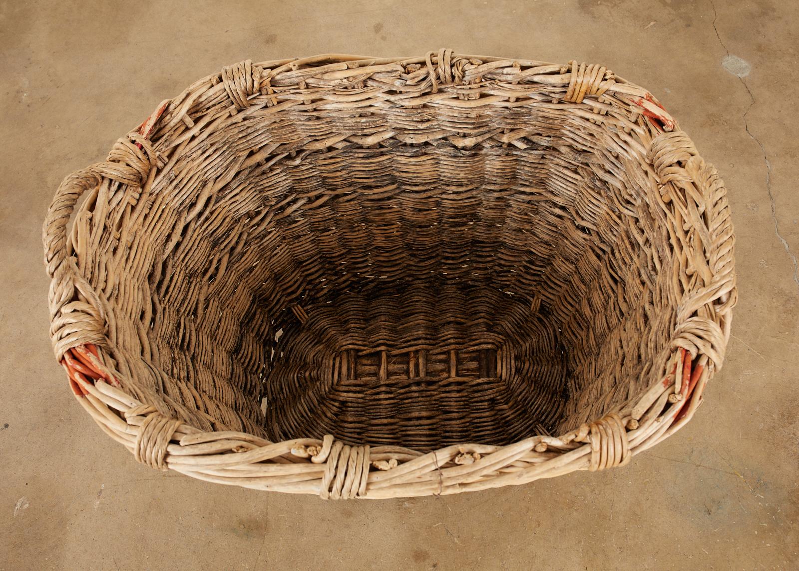 French Woven Wicker Champagne Grape Harvest Basket In Distressed Condition In Rio Vista, CA