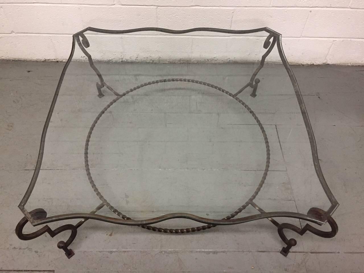 French wrought iron and glass coffee table. Manner of Gilbert Poillerat.



   