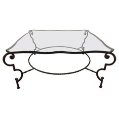 Couchtisch aus Schmiedeeisen und Glas im Stil von Gilbert Poillerat