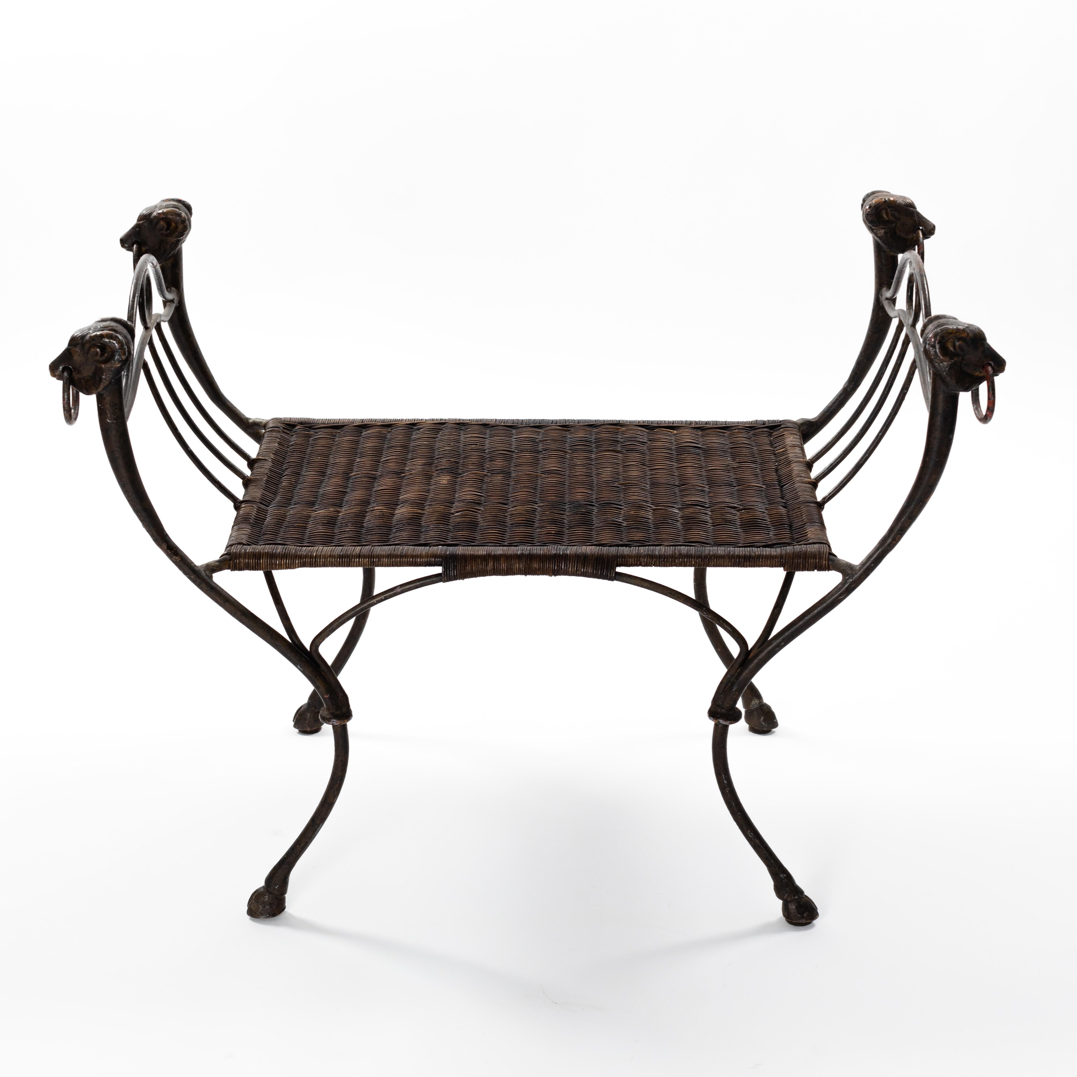 French iron bench with ratan seat wickerwork from the 1940s

Very decorative and light-footed iron bench with counterheads and hooves as decorative elements.
The connecting elements are rounded and give the object a swinging, flowing character