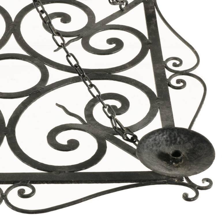 An unusual French Art Deco wrought iron chandelier with a decorative ‘pierced’ design, circa 1930.

Measures: 39? wide x 39? deep x 23.5? tall (hanging, including chain).



  