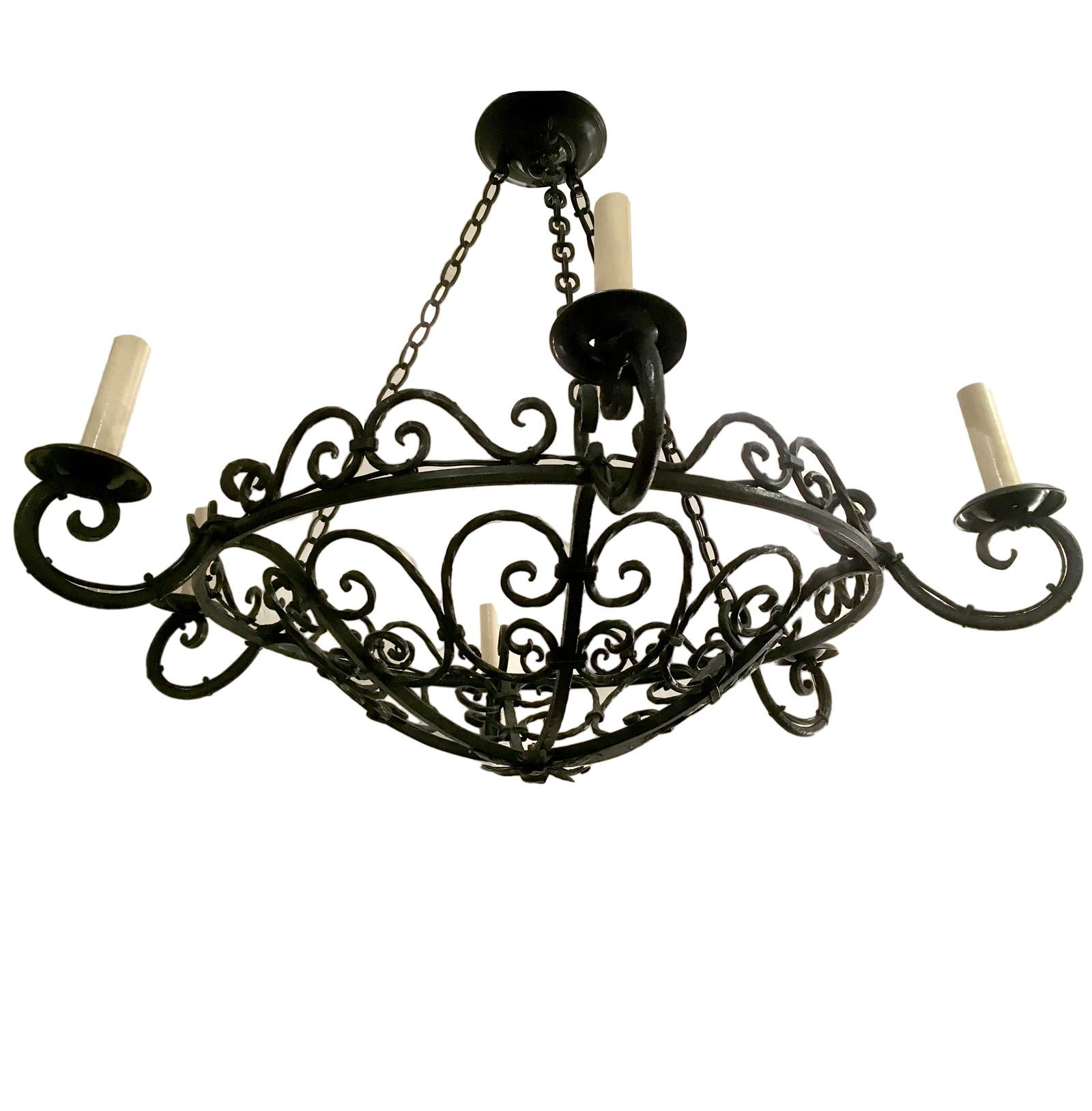 A circa 1930s French wrought iron chandelier with six lights.
Measurements:
33