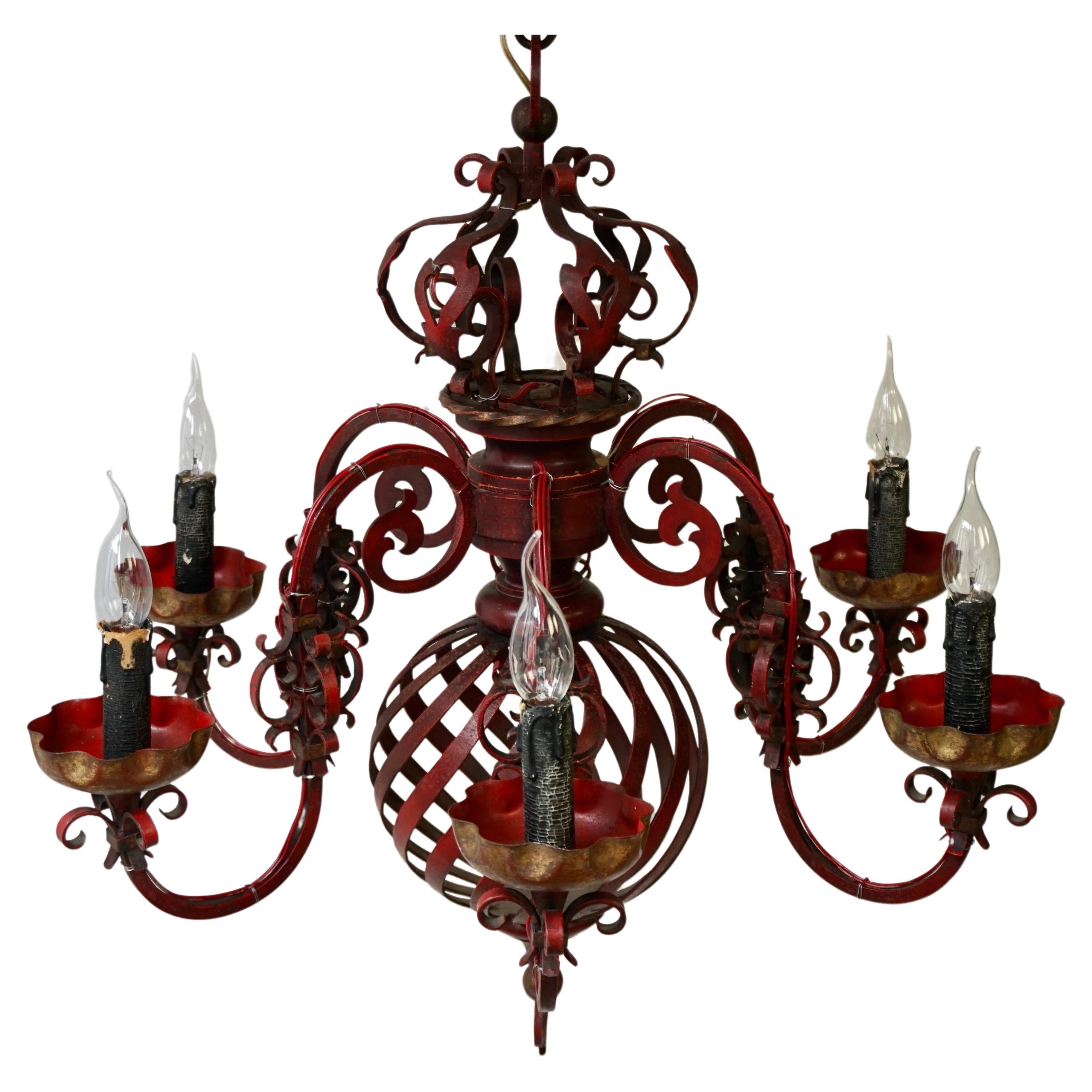 French red wrought iron chandelier with crown has six candelabra arms with gilt on each arm. This wonderful chandelier is suspended by original chain. This chandelier would work beautiful over a pool table, kitchen island, dining table, bar, or