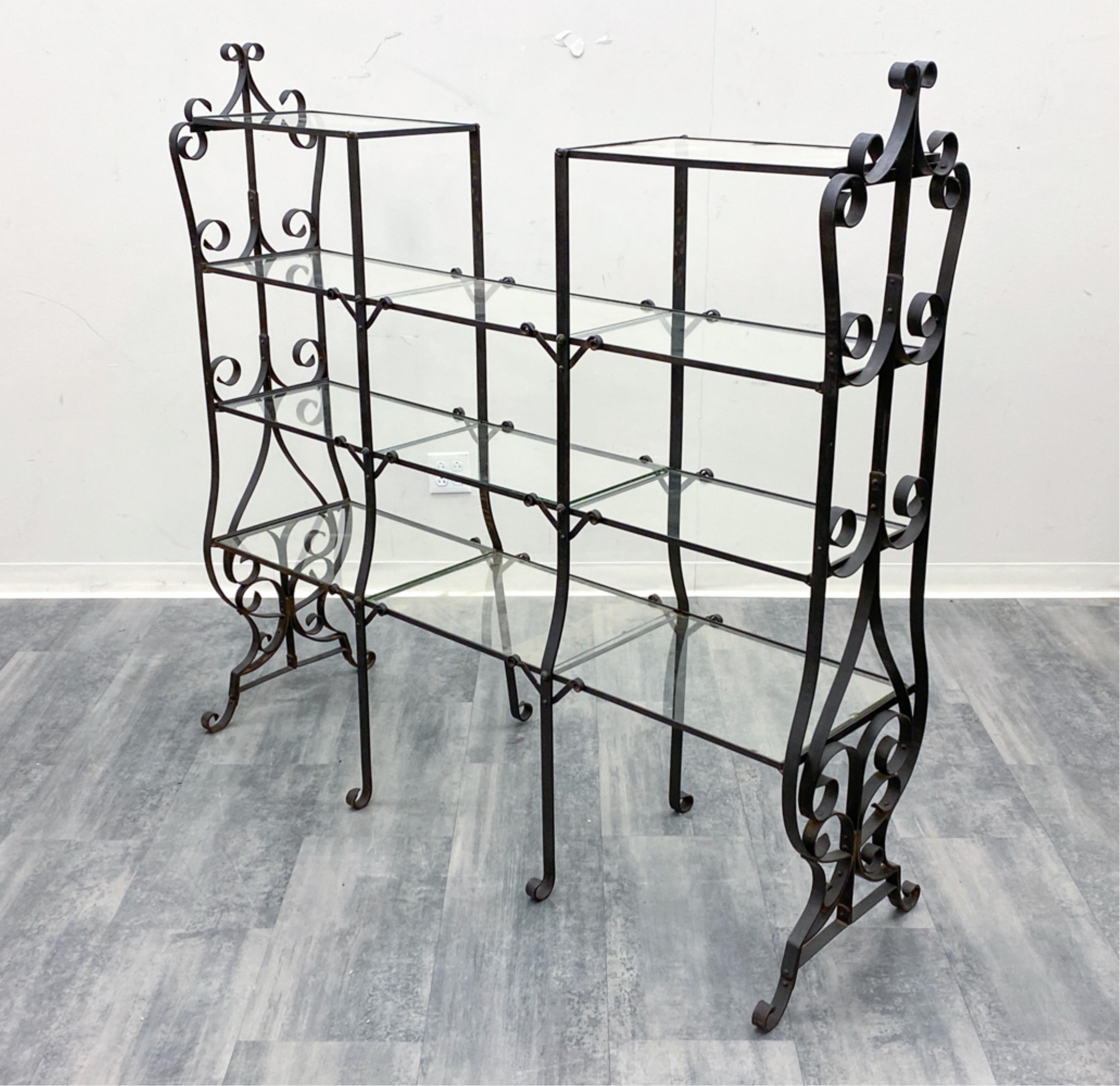 This is a gracefully designed French wrought iron étagère, a piece that seamlessly blends functionality with decorative artistry. This étagère, crafted with meticulous attention to detail, is a testament to the enduring appeal of French