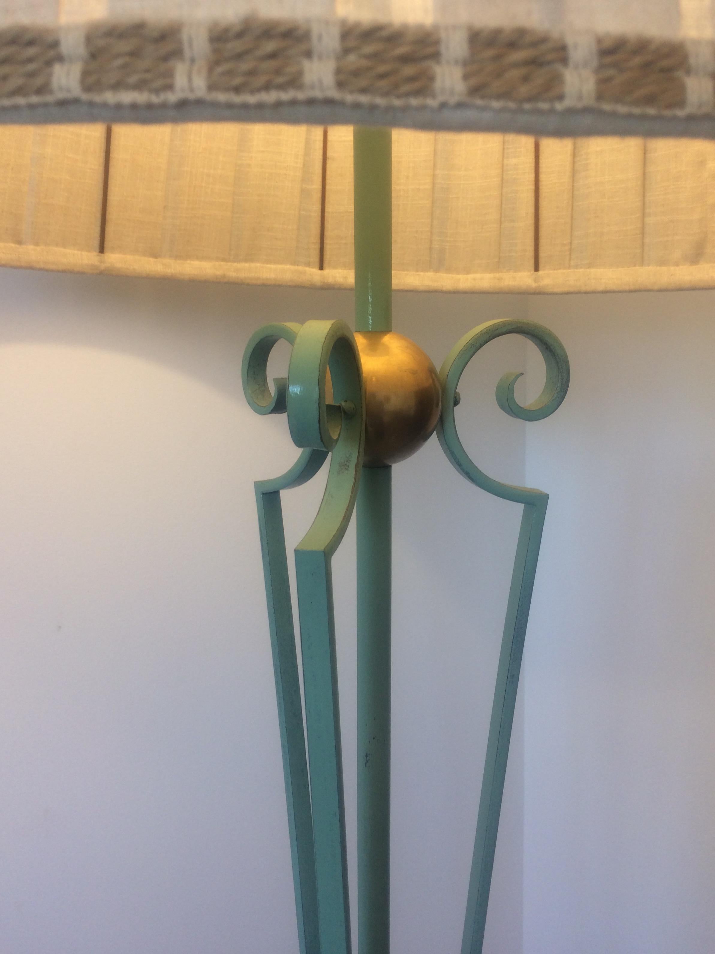 A fine, intricately detailed French wrought iron floor lamp from the design period 1950-1959 in the manner of Gilbert Poillerat. Photographs without the shade provided upon request.

This beautiful practical piece is handcrafted with an eye to