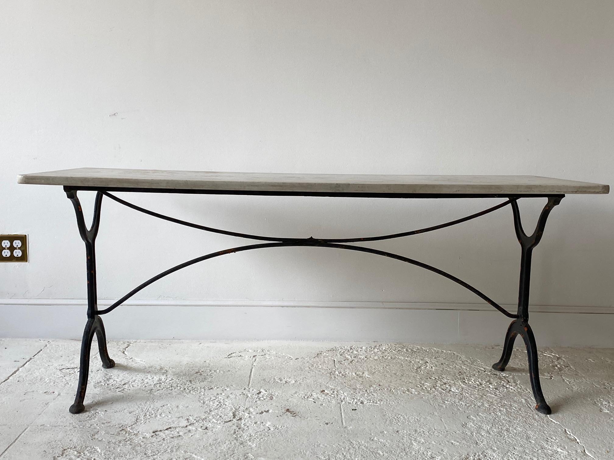 French rectangular wrought iron garden table with marble top.