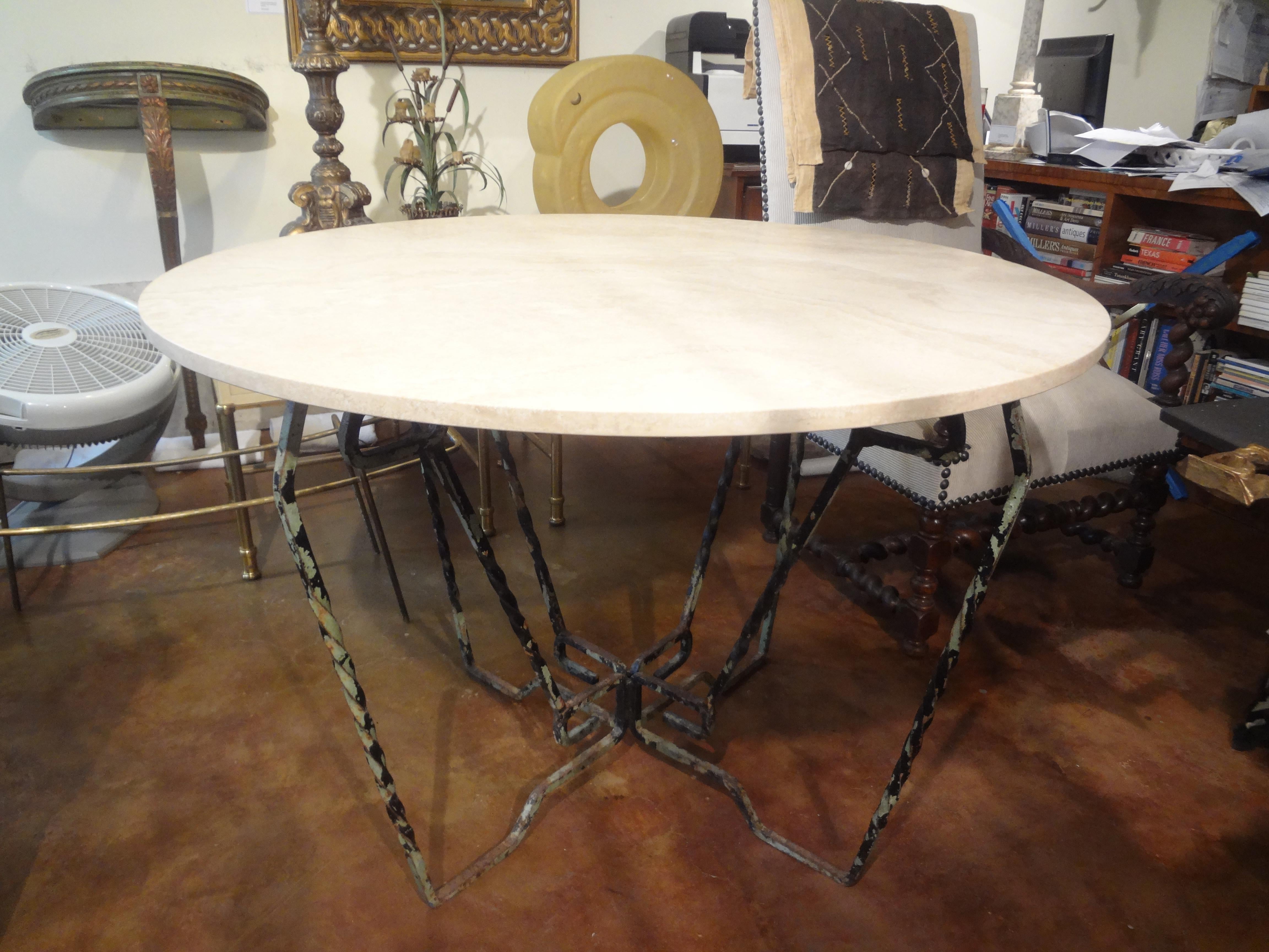 French Wrought Iron Table With Travertine Top.
Our French Neoclassical style hand forged wrought iron center table, dining table or garden table has a Greek key design and a beautiful honed 42 inch travertine top. The iron work has a fantastic