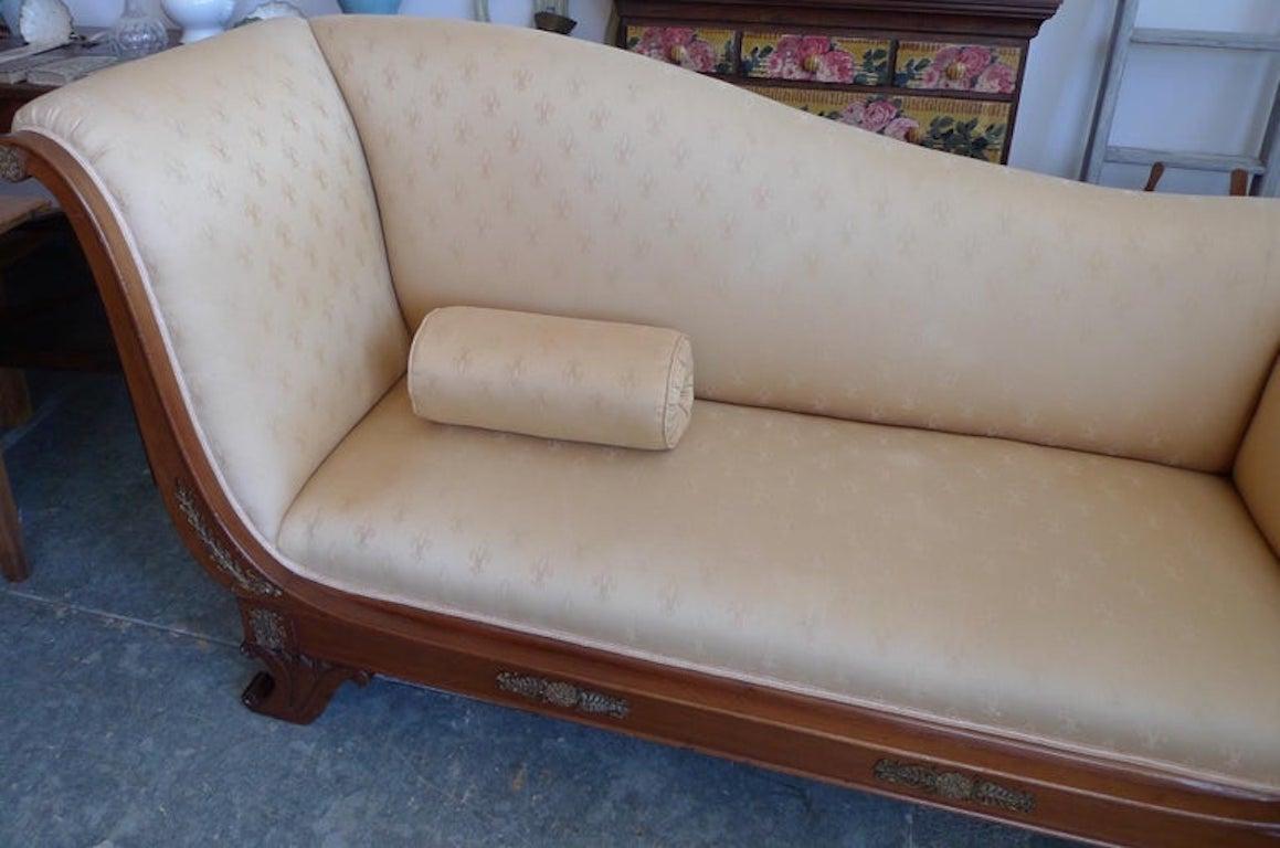 French 19th century Empire walnut chaise lounge reupholstered with vintage fabric.