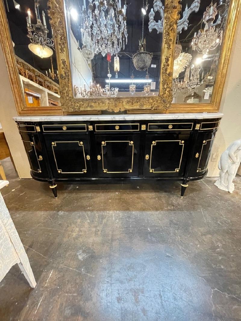 Fine French Louis XVI style black lacquered D-shaped sideboard with gilt brass mounts and Carrara marble top. Circa 1940. Perfect for today's transitional designs!