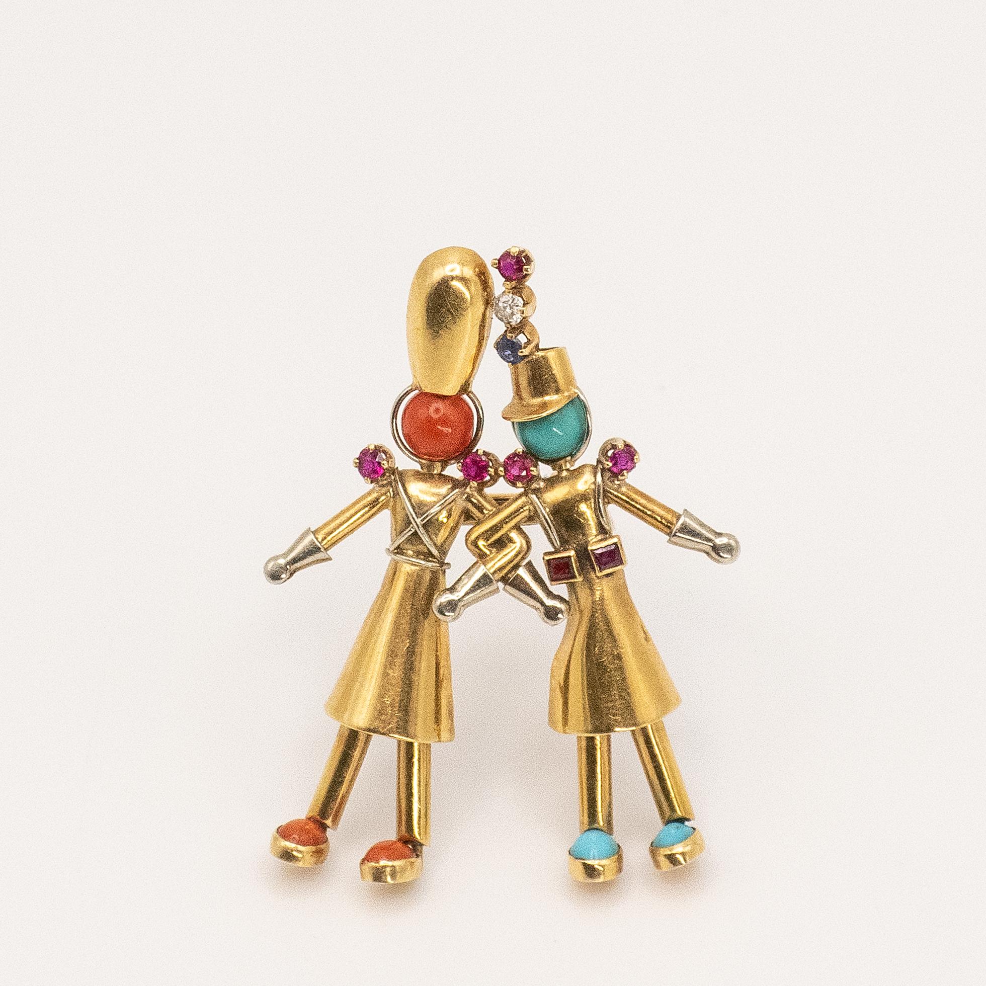 Rare 1940s French Yaeche Freres 2 jovial parade band members in 18K 2-tone gold with diamond cabochon coral and turquoise, facet cut rubies and sapphire fur clip

Approximate Weight: 7.8 grams

Approximate Measurement:
44.7mm x