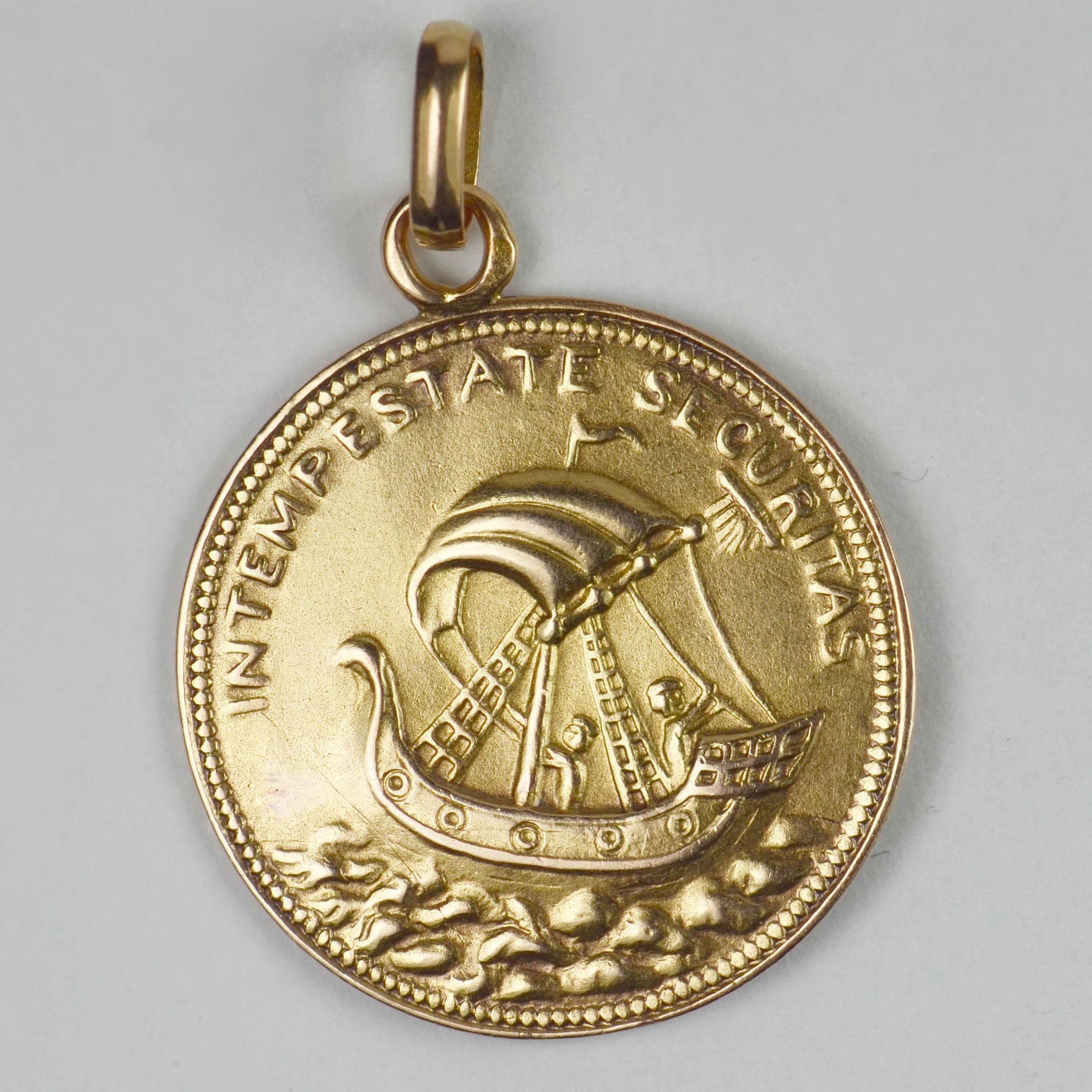 A French 18 karat (18K) yellow gold charm pendant designed as a gold coin depicting St George. Stamped with the eagle's head for 18 karat gold and French manufacture.

One side of the coin shows Saint George on a horse defeating the dragon with the
