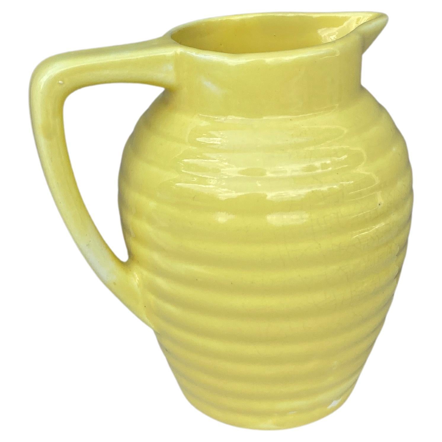 French yellow Majolica pitcher signed Onnaing, circa 1920.