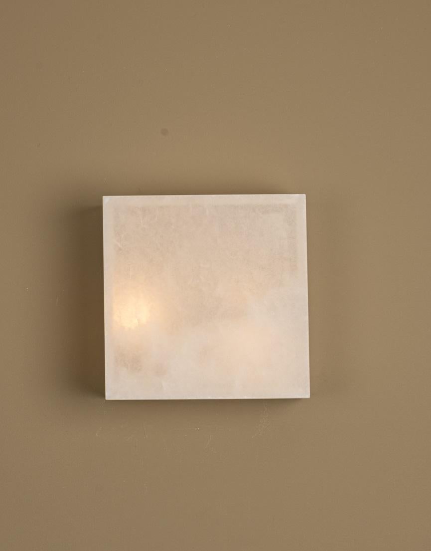 Frene White Alabaster Wall Sconce by Simone & Marcel
Dimensions: D 23 x W 25 x H 25 cm.
Materials: Alabaster.

Custom options available on request. Please contact us. 

All our lamps can be wired according to each country. If sold to the USA it will