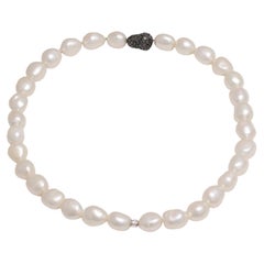 Fresh Water Baroque Pearl Necklace With Gold Lock Set With 1.5ct Black Diamonds