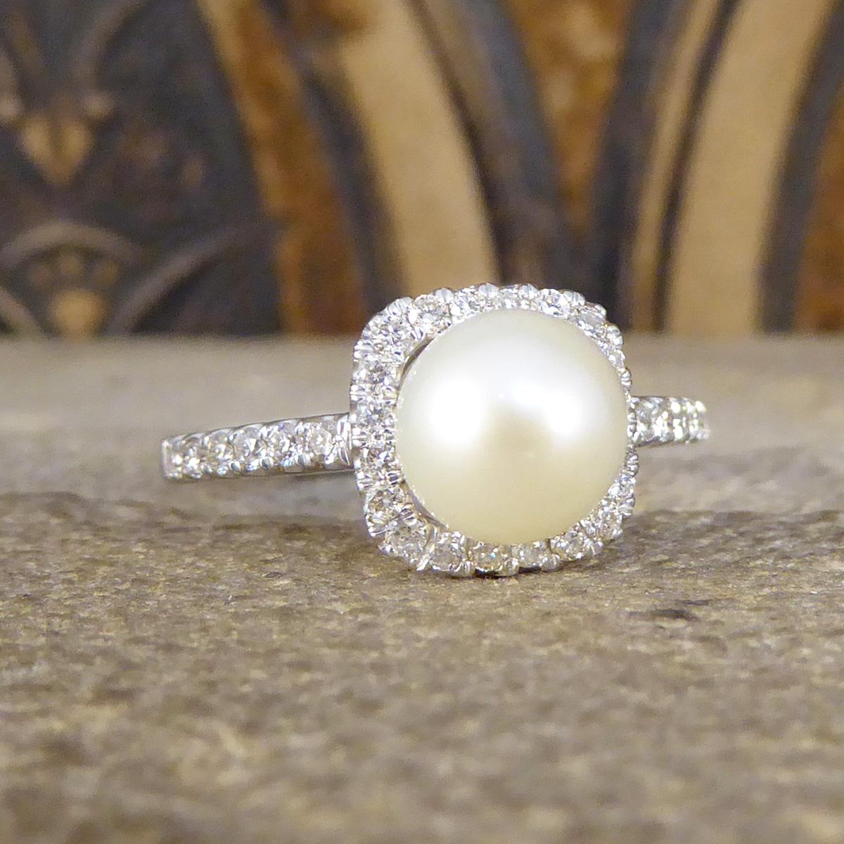 Such a beautiful and dainty ring featuring a Fresh Water Cultured Pearl in the centre with a lovely lustre. Surrounding a gracefully cream centre is a square shaped halo of small and sparkly Diamonds set around the Pearl and down each shoulder