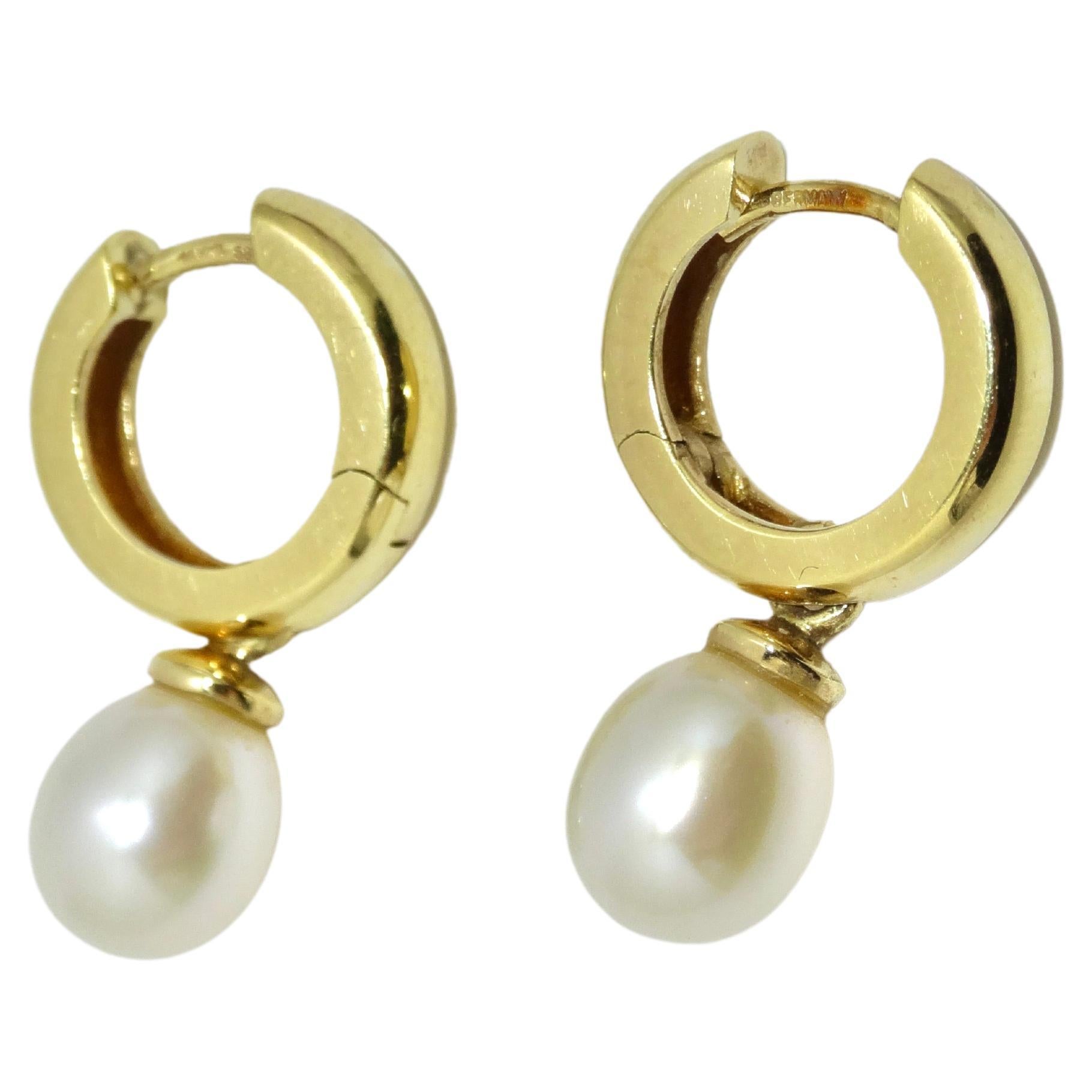 Add a pair of classic pearl earrings to your jewelry collection. You cannot go wrong with the classic gold and pearl combo! It creates a sense of elegance and effortlessness. These are the perfect size to wear day-to-day and with the 14k gold