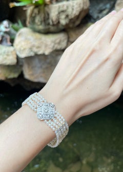 Süßwasserperlen- und Diamantarmband in 18K Goldfassung